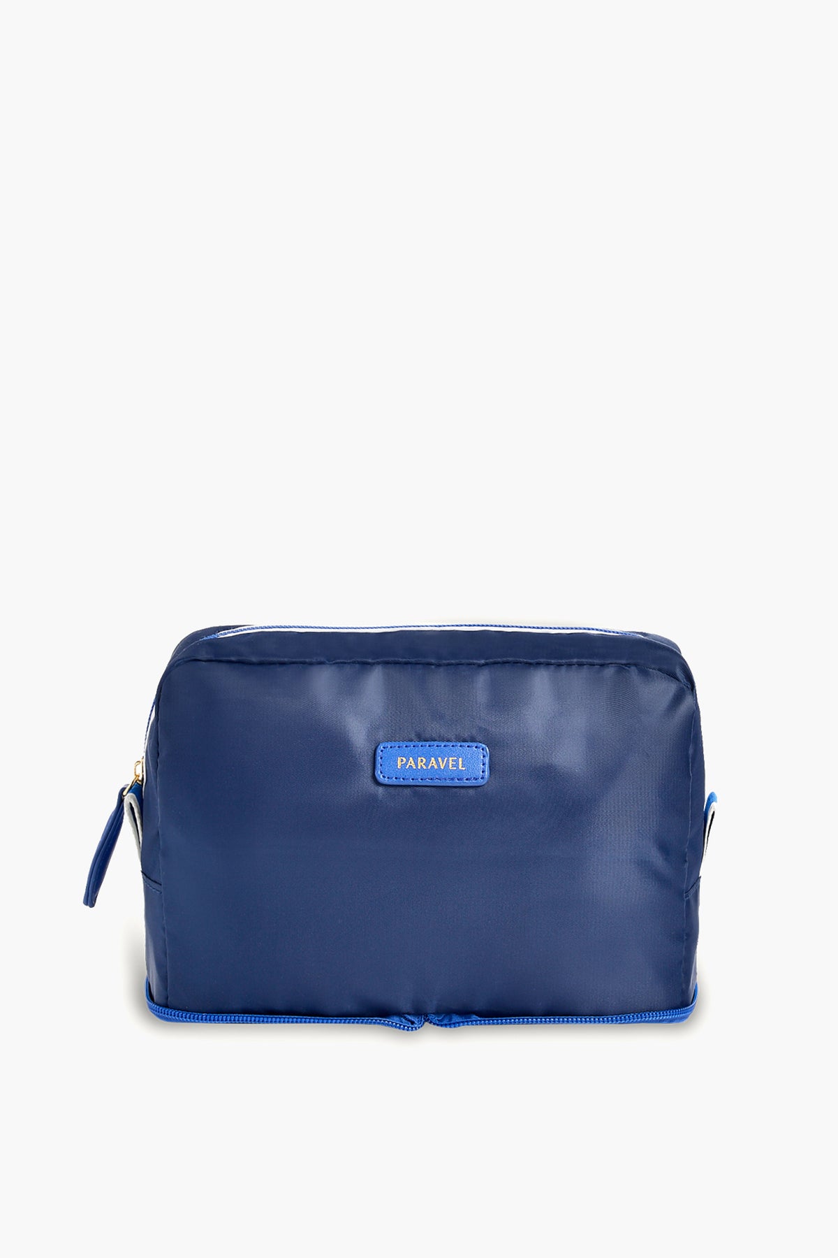 A blue rectangular zippered toiletry bag by Paravel, featuring a small front label—ideal for use as a travel organizer.