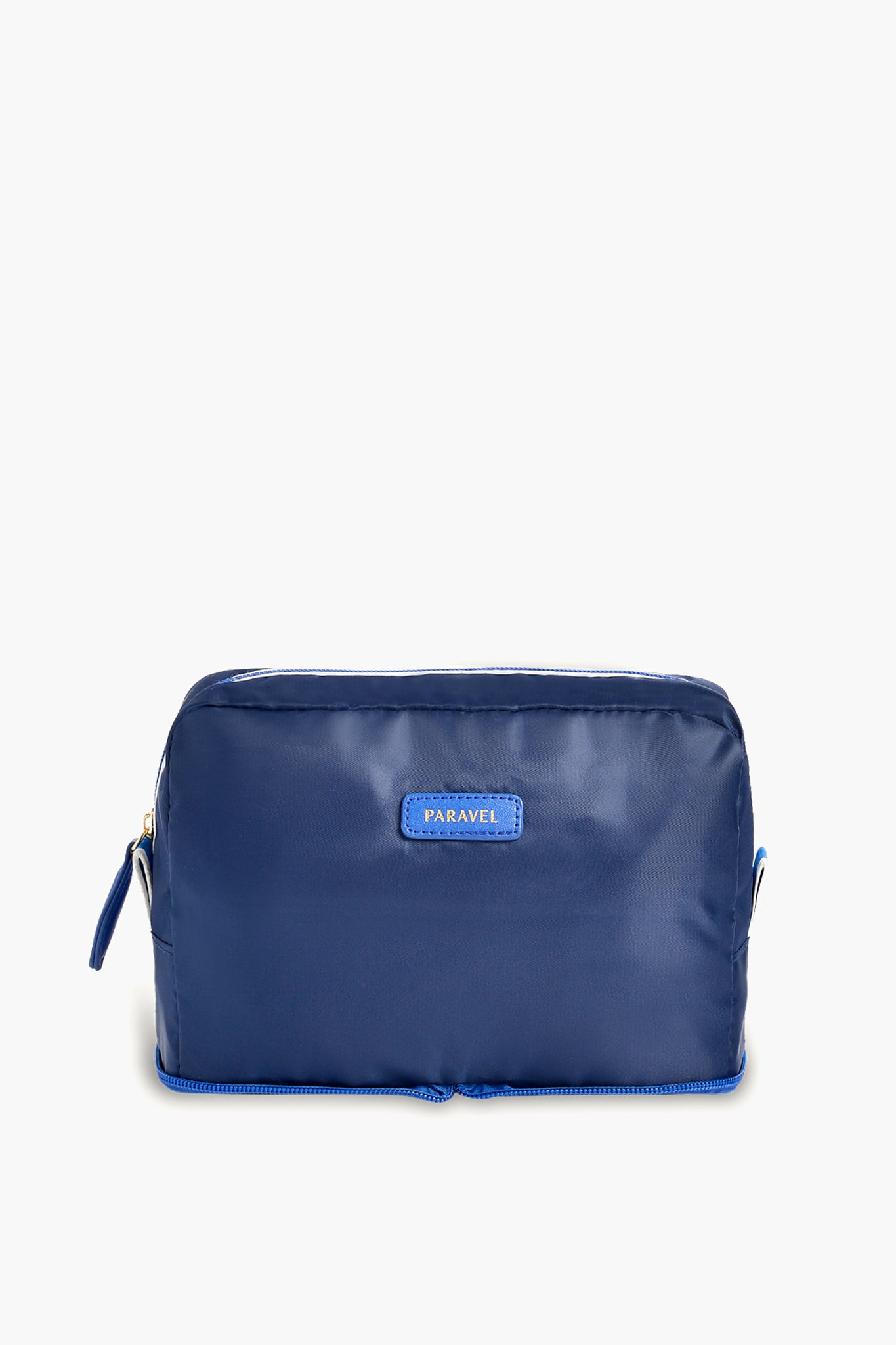A blue rectangular zippered toiletry bag by Paravel, featuring a small front label—ideal for use as a travel organizer.
