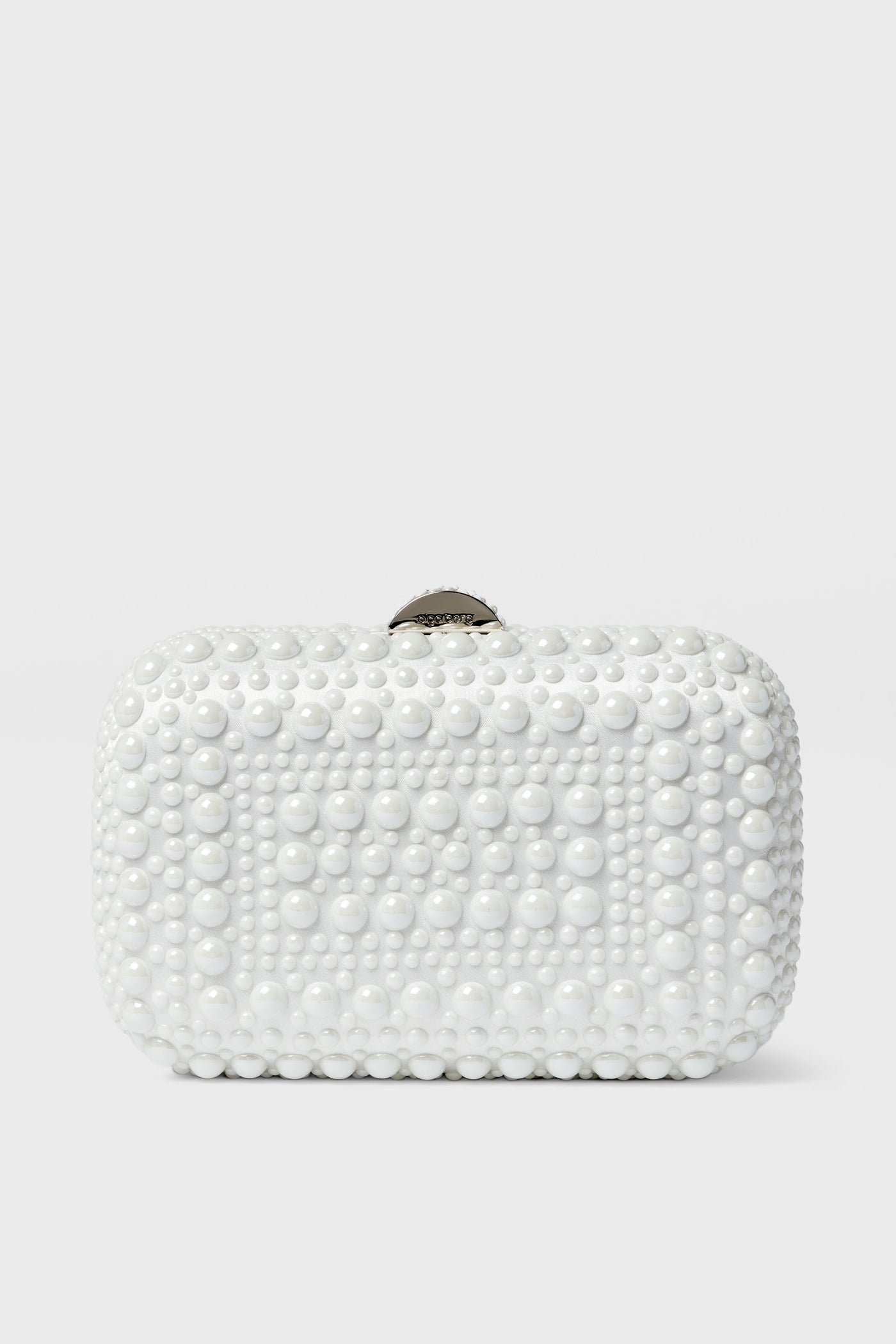 The Olga Berg rectangular white clutch, featuring a textured pattern of raised round beads, is an elegant choice for evening bags and special occasions.