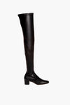 A single STAUD black over-the-knee vegan leather boot with a low block heel and rounded toe is displayed.