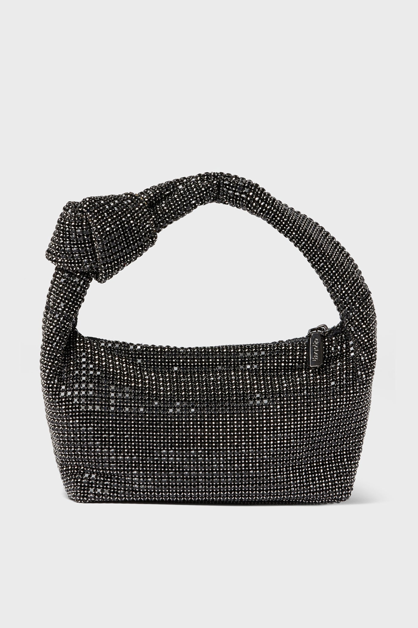 A black, beaded Olga Berg evening bag with a knotted handle and a small rectangular tag—ideal for special occasions.