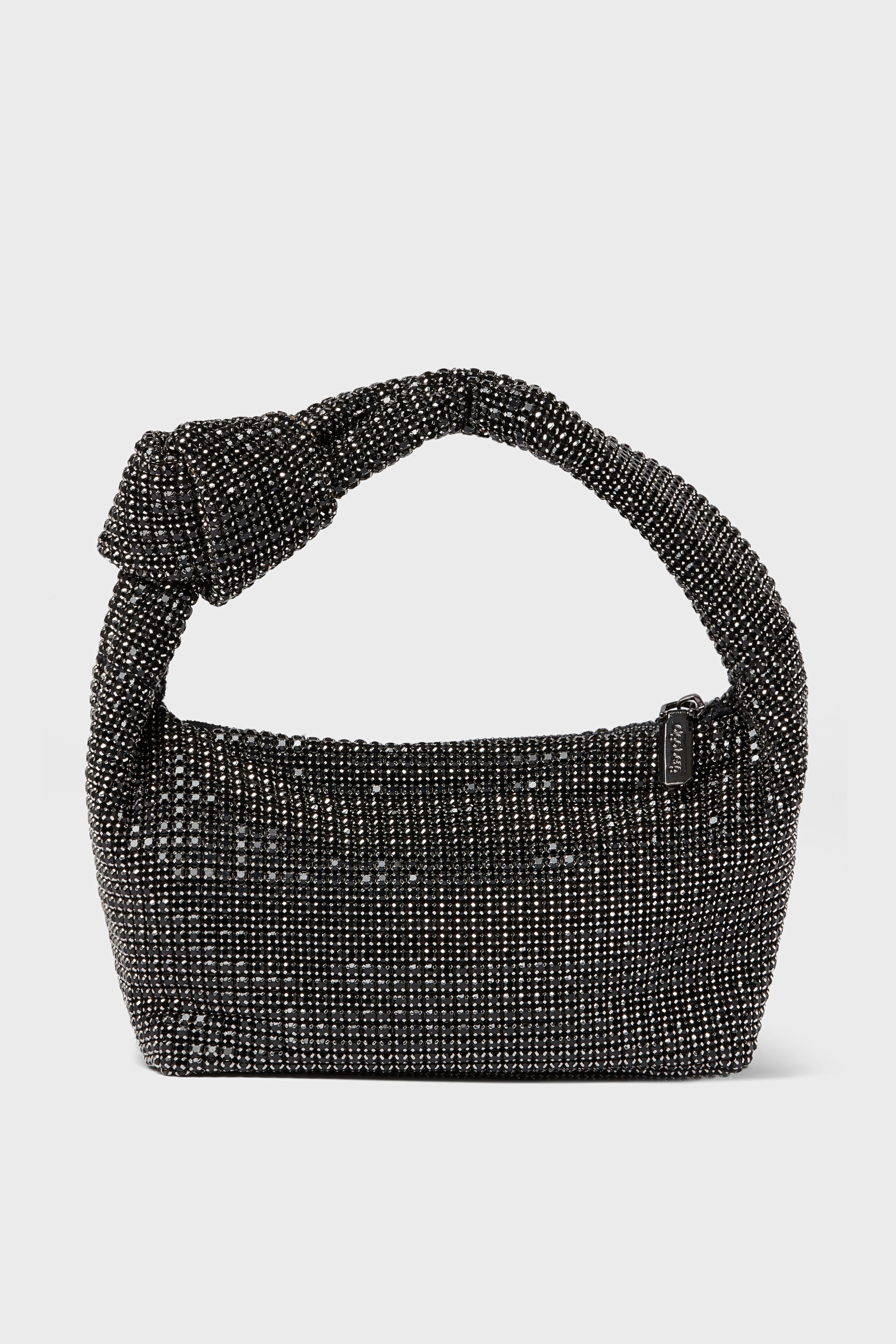 A black, beaded Olga Berg evening bag with a knotted handle and a small rectangular tag—ideal for special occasions.