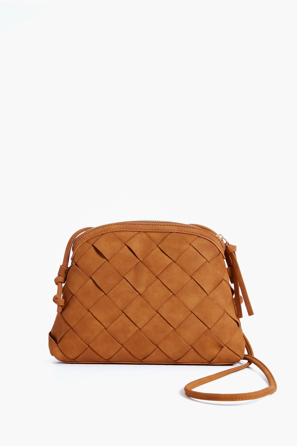 The image shows a Moda Luxe small brown crossbody bag made of suede leather with a woven pattern, zipper closure, and thin strap.