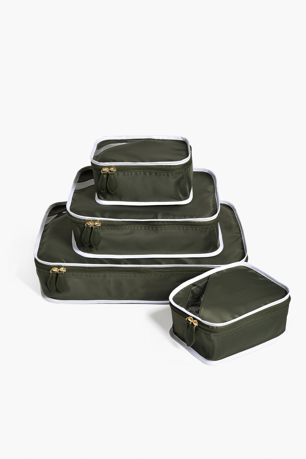 Paravel’s set of four olive green packing cubes with white trim and gold zippers keeps your travel essentials organized and adds style to your sustainable luggage collection.