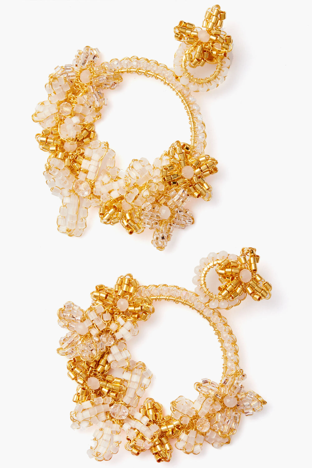 Lavish large gold hoop earrings feature intricate clear and gold beaded floral designs, 18k gold-plated accents, and hand-crocheted jewelry details.