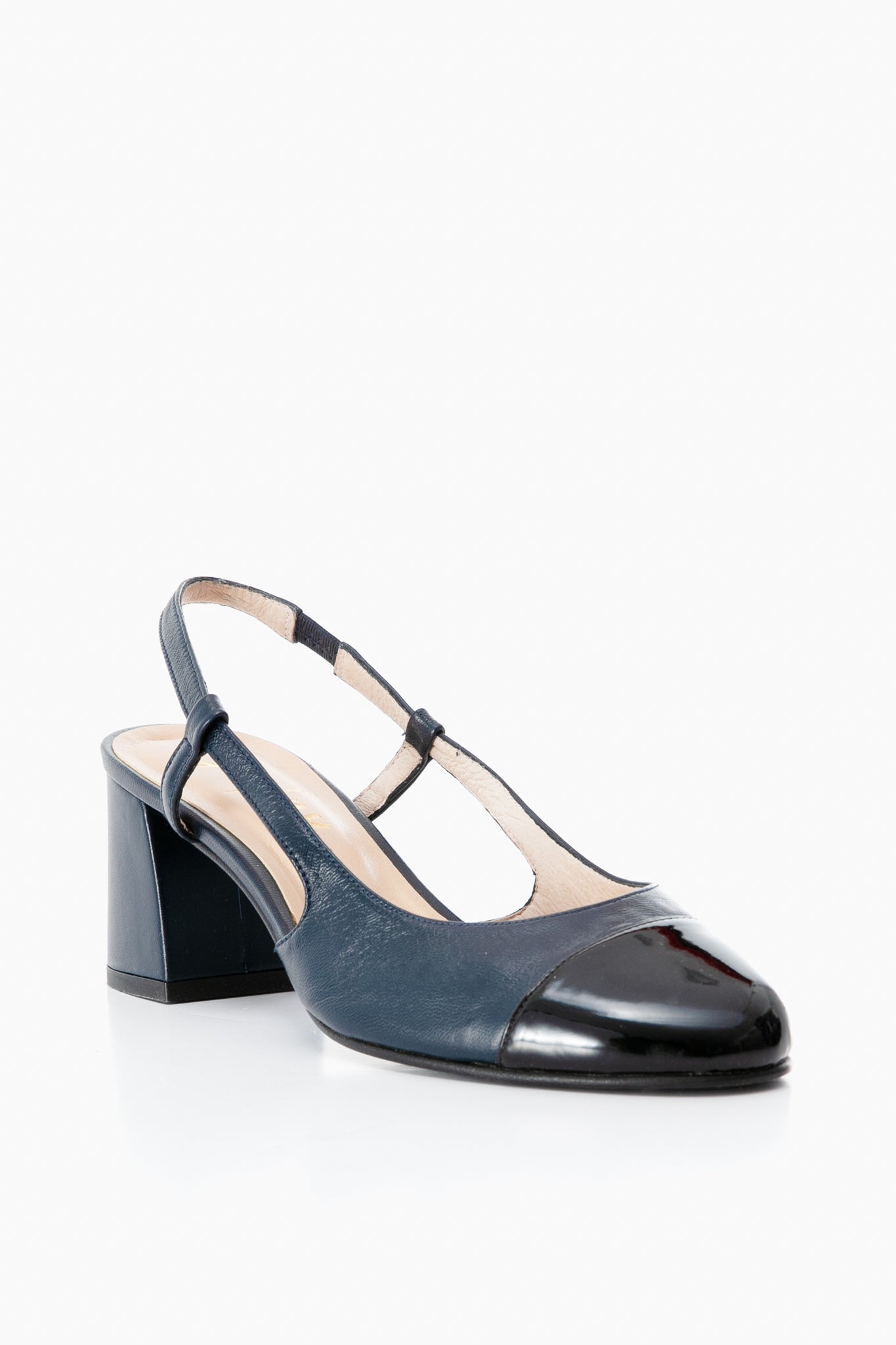 A navy blue color-blocked slingback pump by French Sole featuring a block heel and a black patent leather toe cap.
