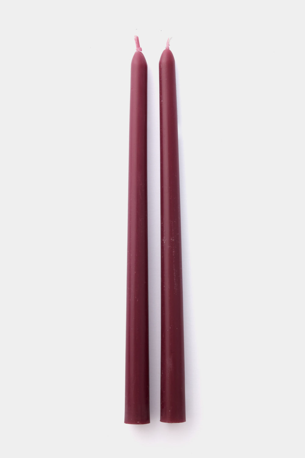 Two Greentree Home burgundy beeswax taper candles, hand-poured and elegantly upright side by side, make perfect gift box candles.