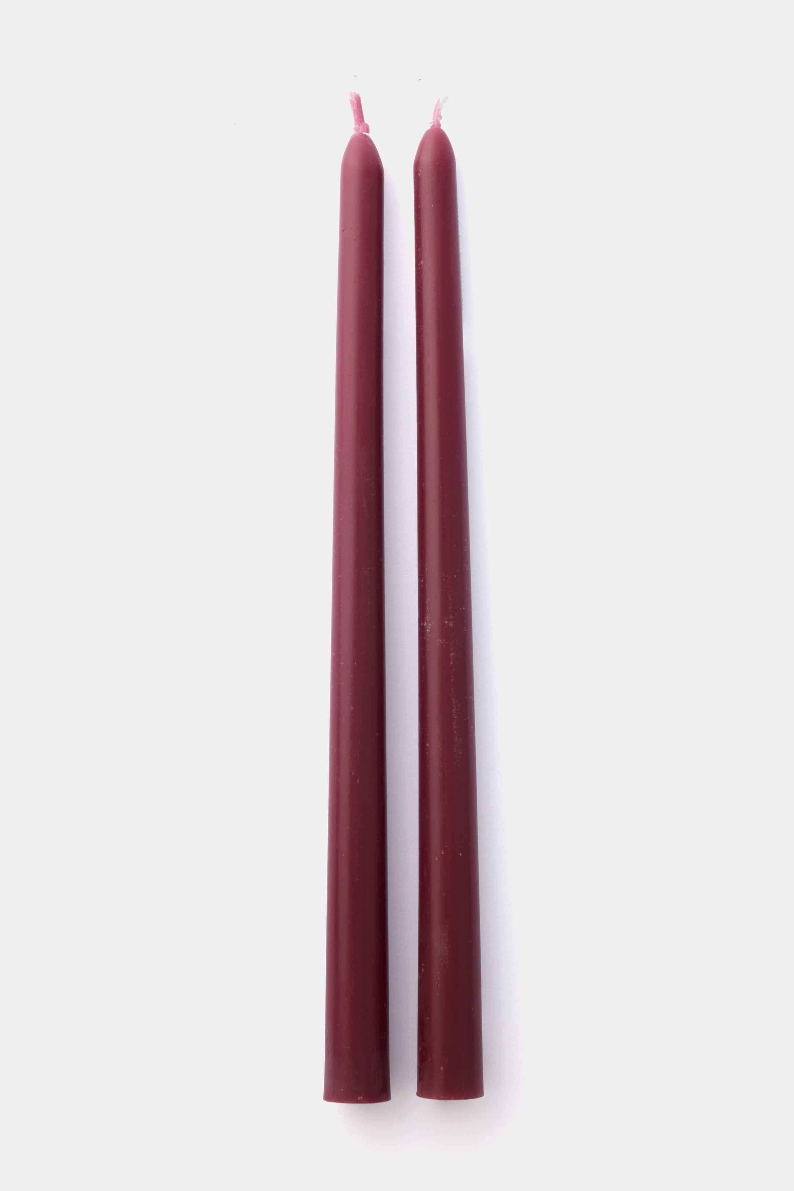 Two Greentree Home burgundy beeswax taper candles, hand-poured and elegantly upright side by side, make perfect gift box candles.