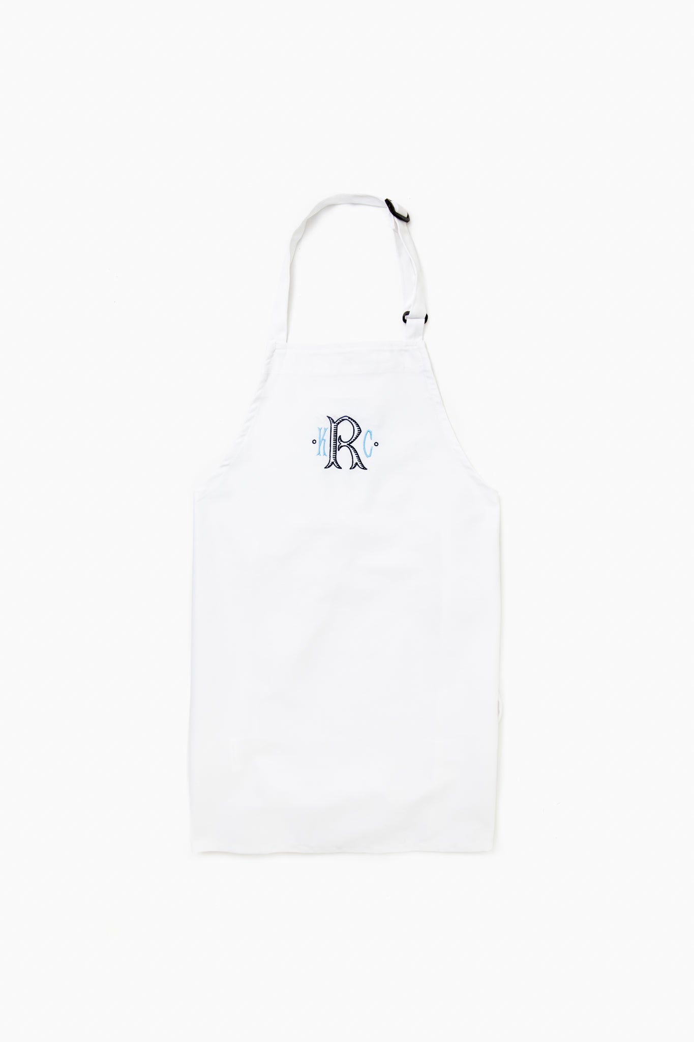 The Caton's Wharf white adjustable neck apron features a blue letter R monogram on the chest and is crafted from wrinkle-resistant fabric for durability and style.