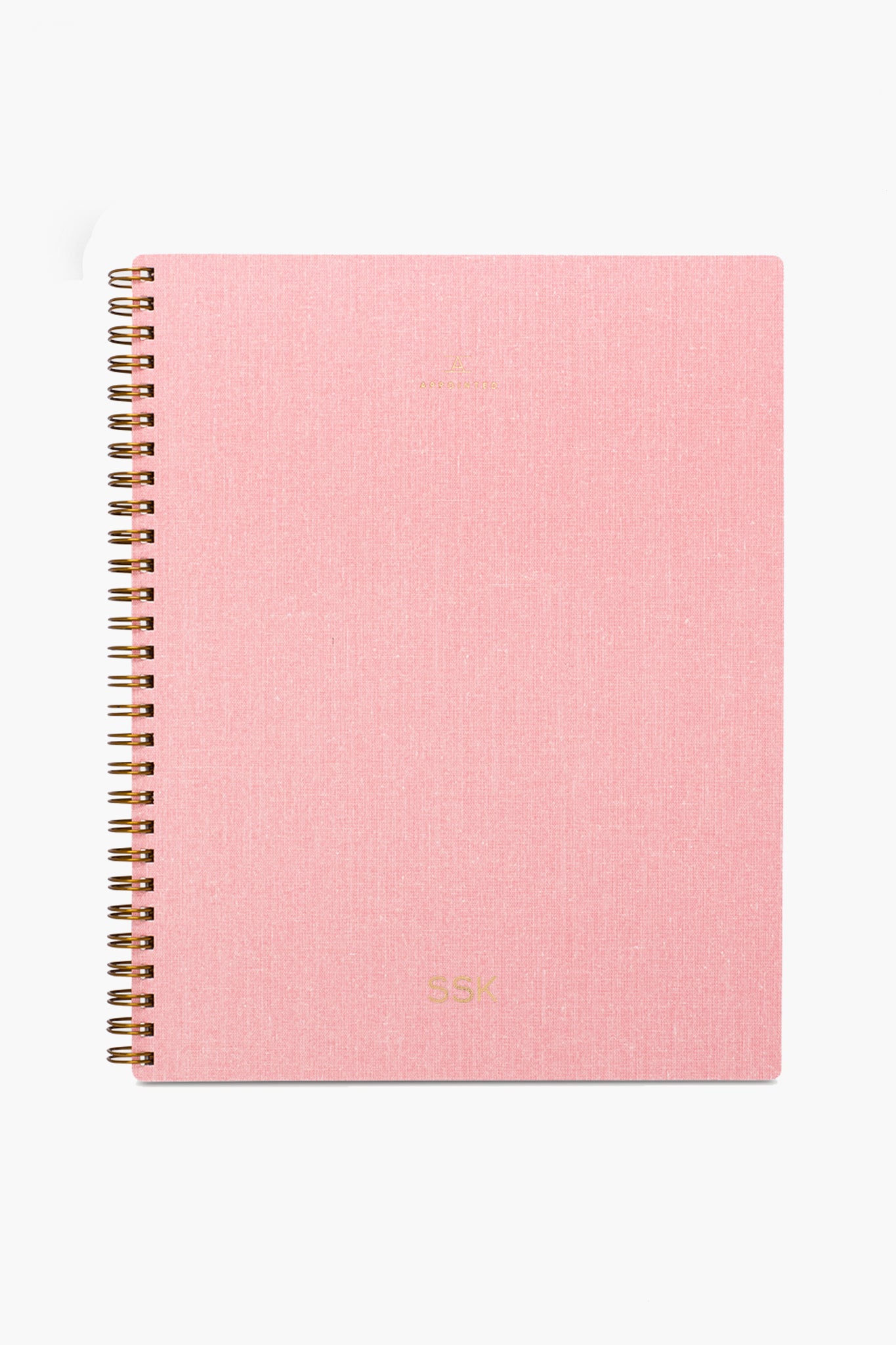 The APPOINTED Blossom Pink Lined Notebook features a textured book-cloth cover, gold lettering, spiral binding, and is crafted from recycled paper.
