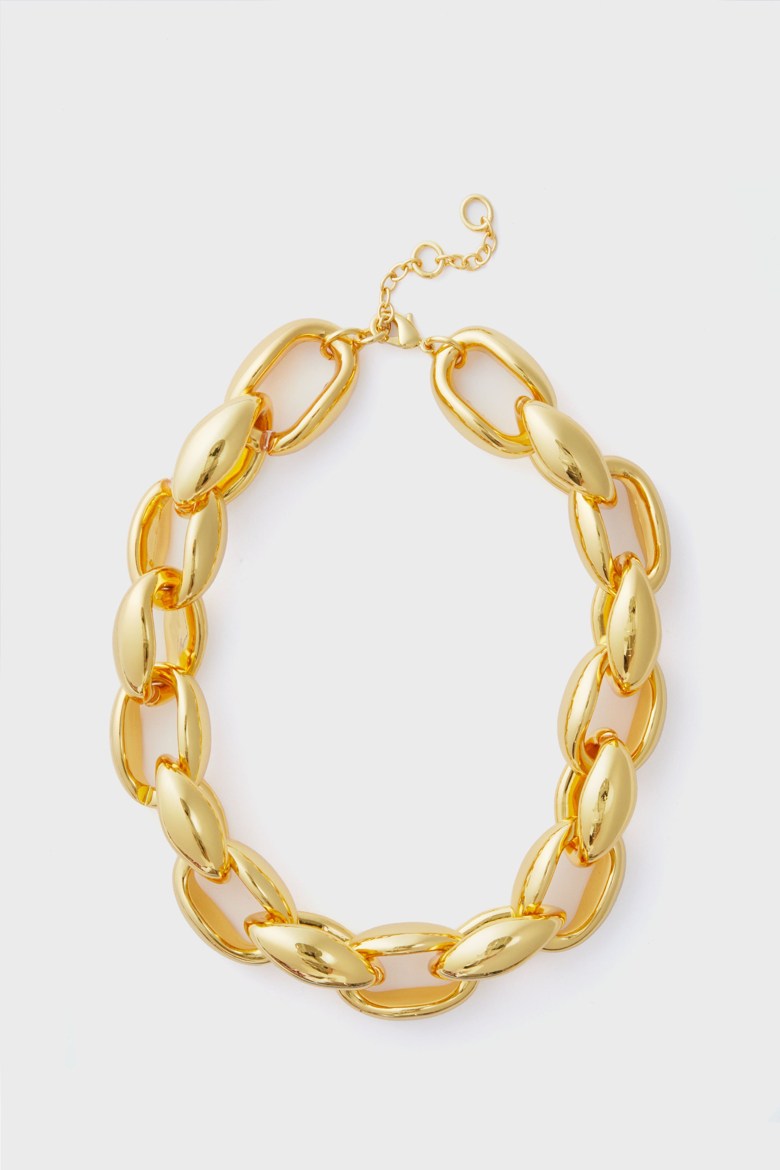 The Tuckernuck Jewelry chunky gold necklace features large oval links and an adjustable clasp, making it a bold statement chain.