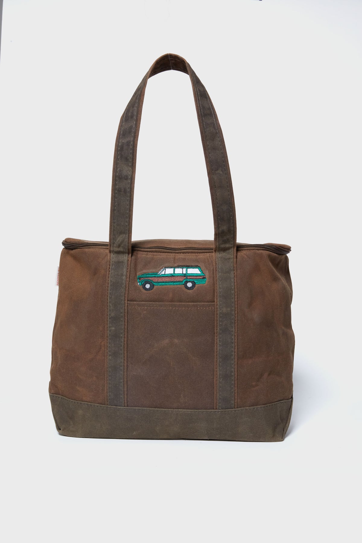 Caton's Wharf brown waxed canvas cooler tote bag with two handles, featuring an embroidered green station wagon on the front.