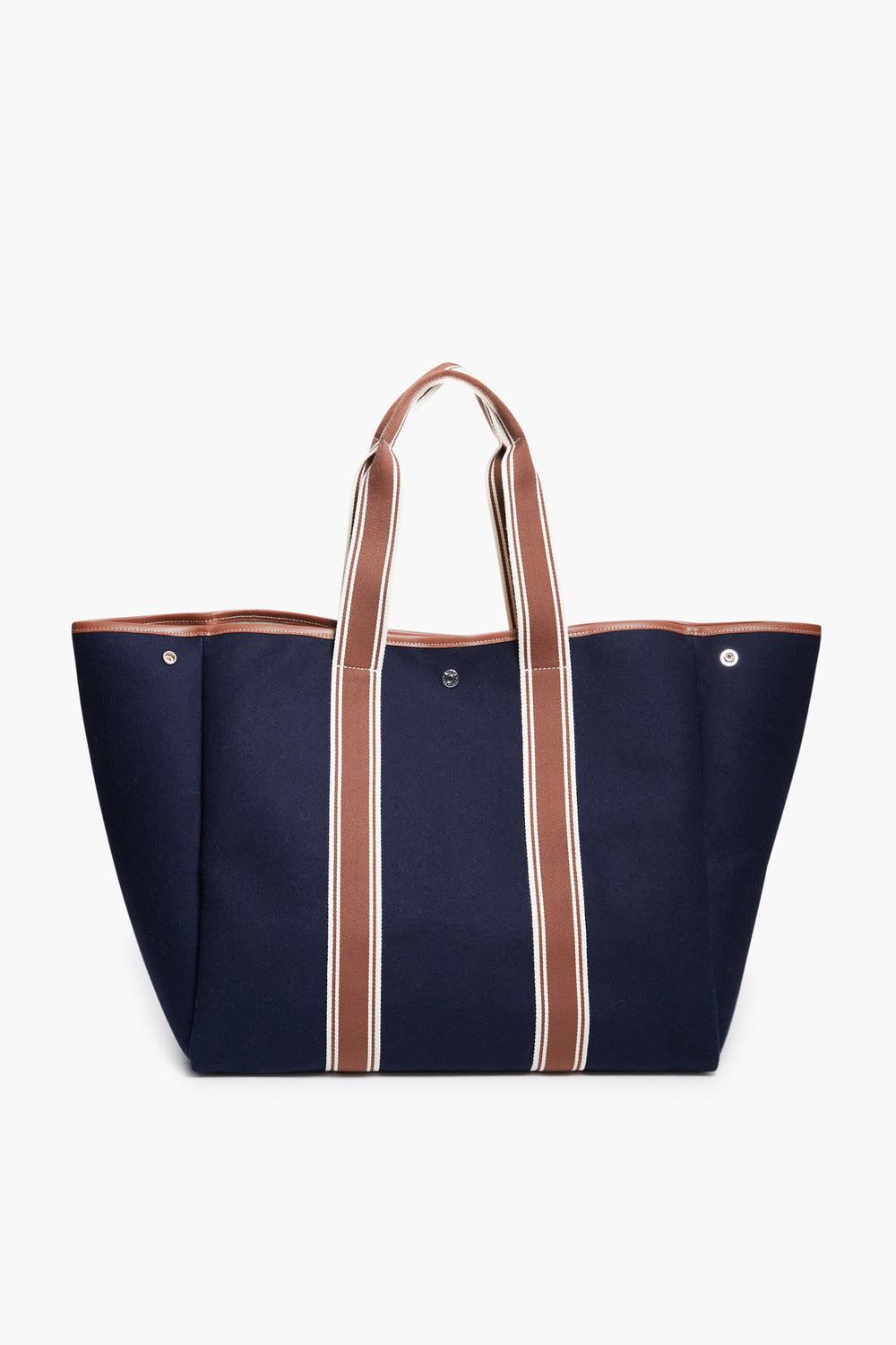 The Rue de Verneuil large navy blue flannel tote bag features brown and white striped handles. Made in France, it's ideal for those seeking luxury luggage.