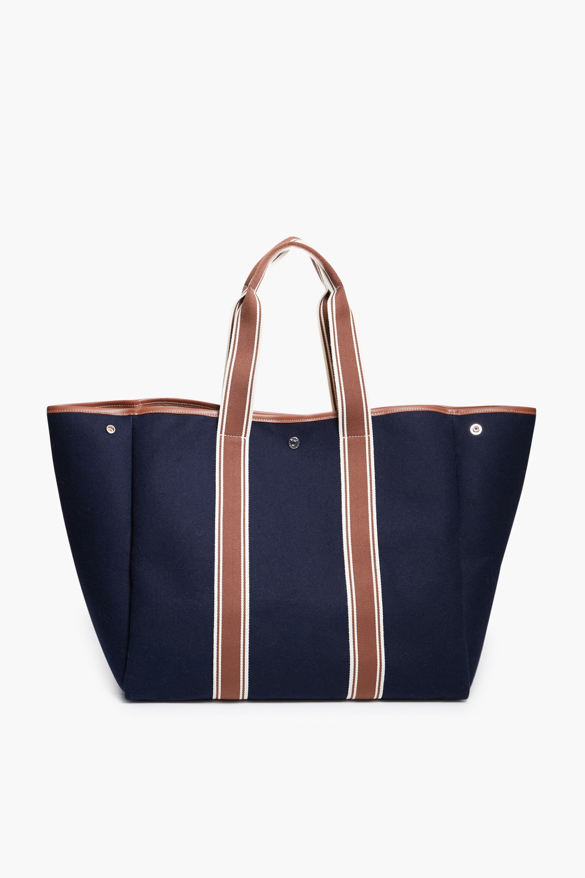 The Rue de Verneuil large navy blue flannel tote bag features brown and white striped handles. Made in France, it's ideal for those seeking luxury luggage.