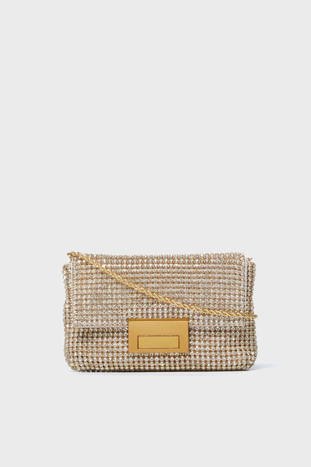 The Loeffler Randall rectangular gold crossbody clutch features a beaded exterior, glass rhinestones for added elegance, a gold chain strap, and a rectangular gold clasp.