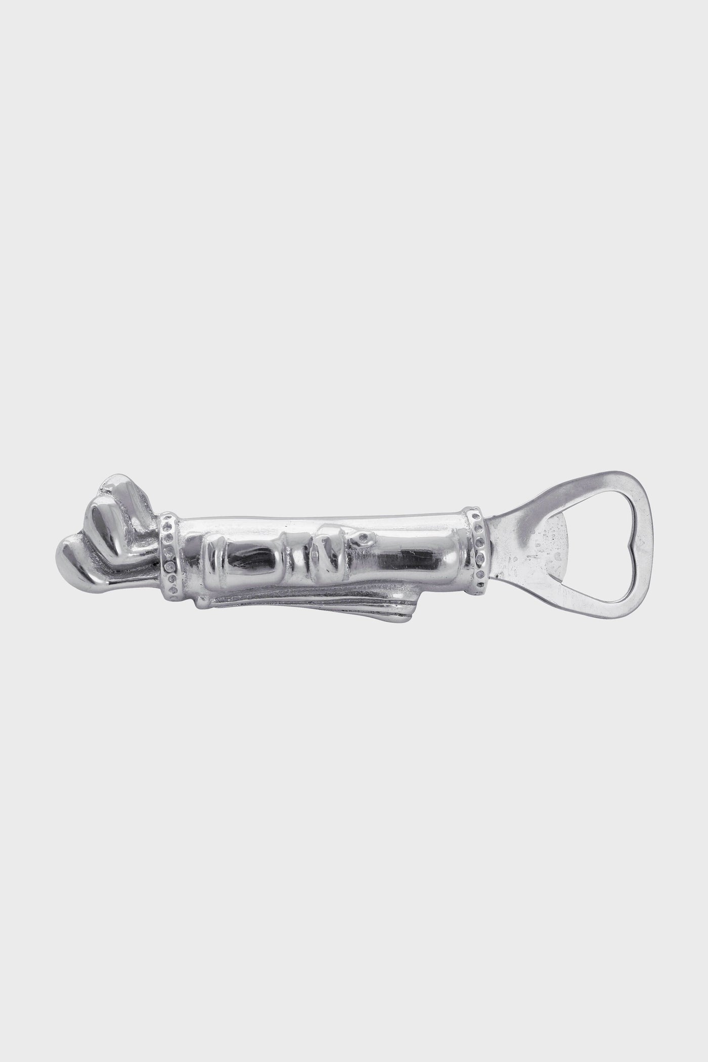 The Mariposa silver metal bottle opener is handcrafted from recycled aluminum and features a decorative handle with a sculpted face and hand design.