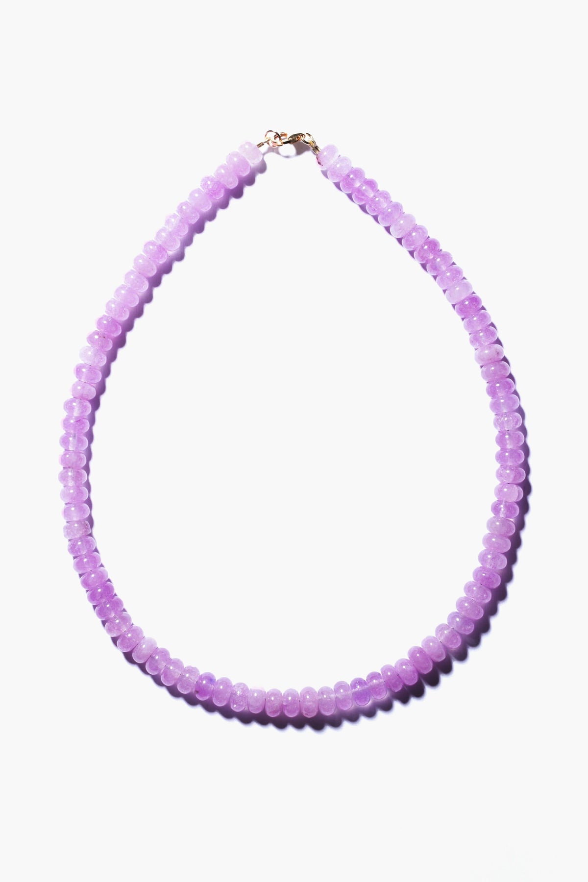 Theodosia necklace featuring round, translucent lavender beads and a gold-fill clasp, exemplifying handcrafted fine jewelry.