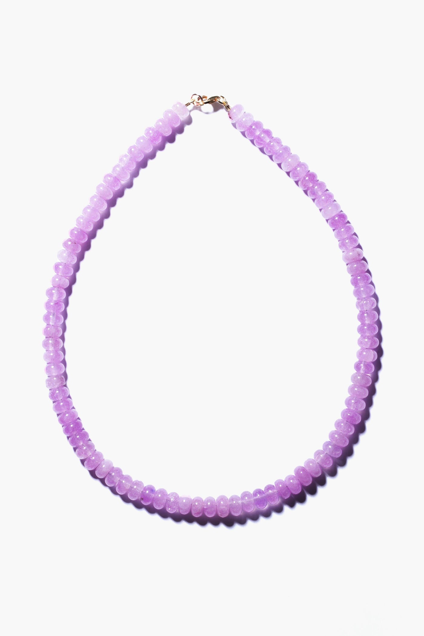 Theodosia necklace featuring round, translucent lavender beads and a gold-fill clasp, exemplifying handcrafted fine jewelry.