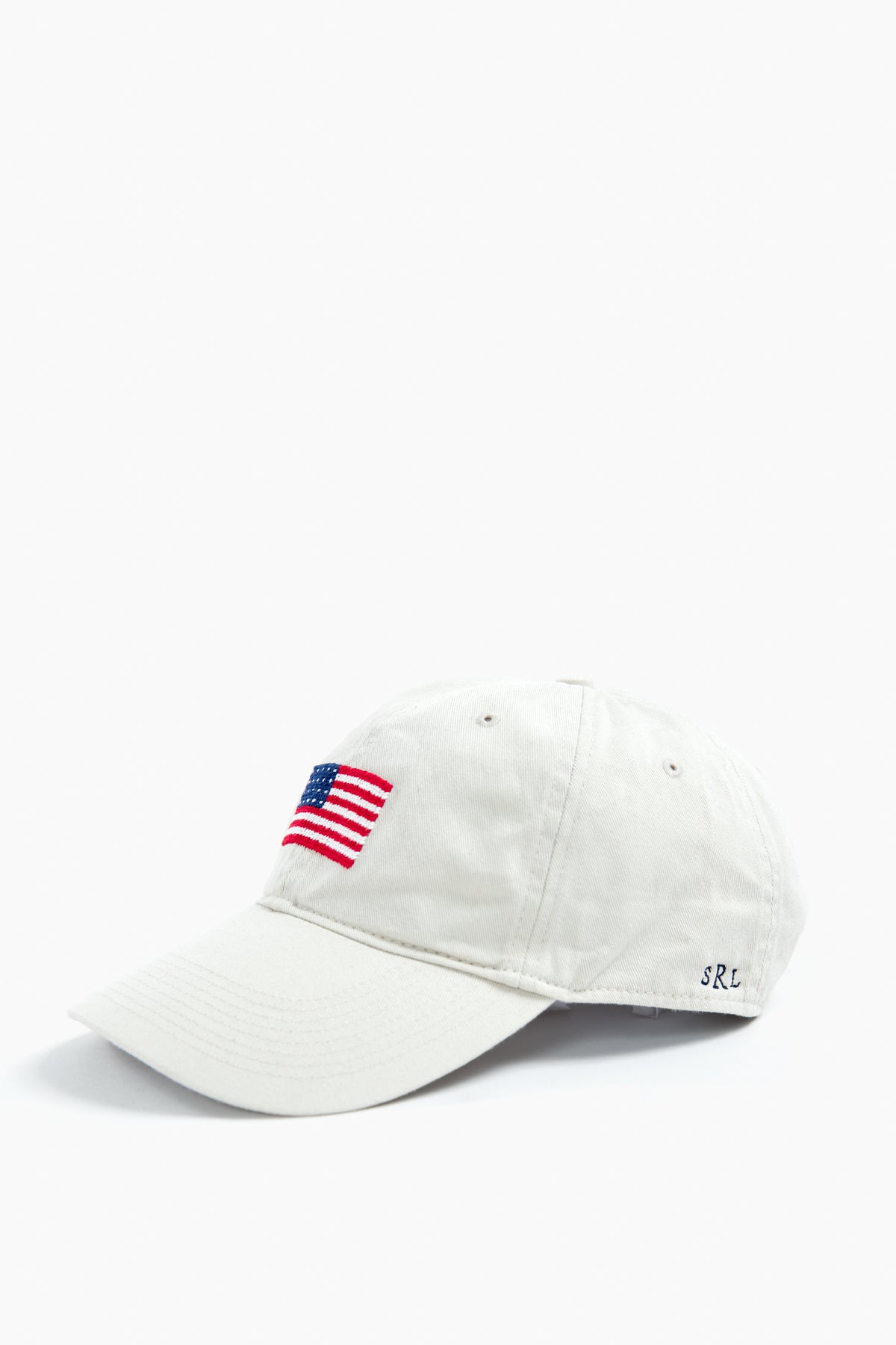 A white cotton twill hat from Smathers and Branson, featuring an embroidered American flag on the front and SRL initials stitched on the side—ideal for unique gifts.