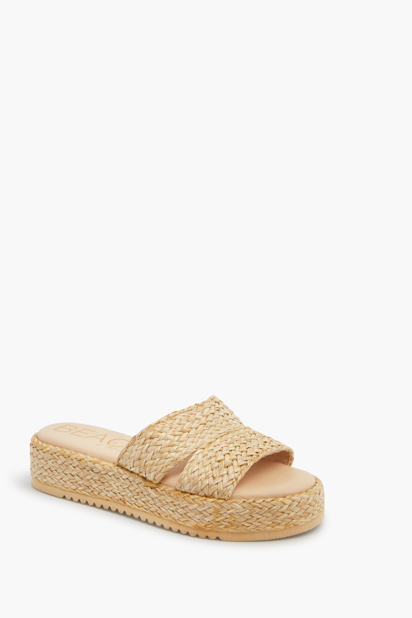 The Matisse beige woven straw platform slide features a chunky sole, two crisscross straps, and a cushioned footbed—ideal for fans of chunky platform sandals.