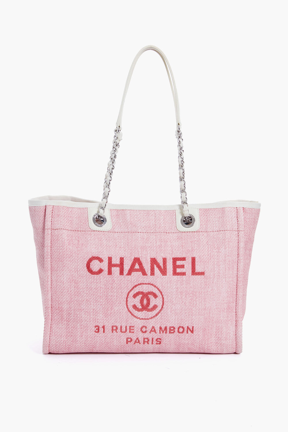 A pink Tuckernuck Archive Collection tote with white handles, featuring the brand logo and classic text on the front.