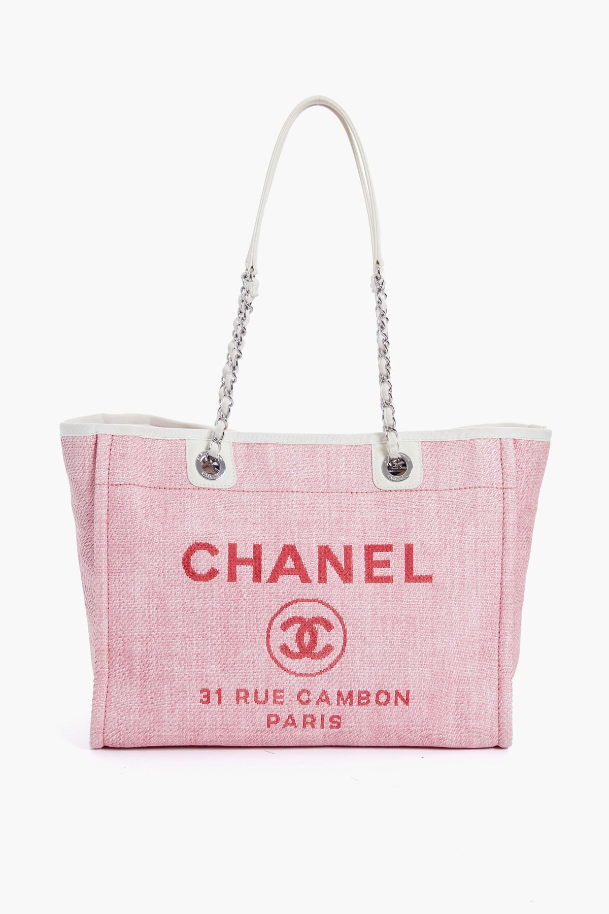 A pink Tuckernuck Archive Collection tote with white handles, featuring the brand logo and classic text on the front.
