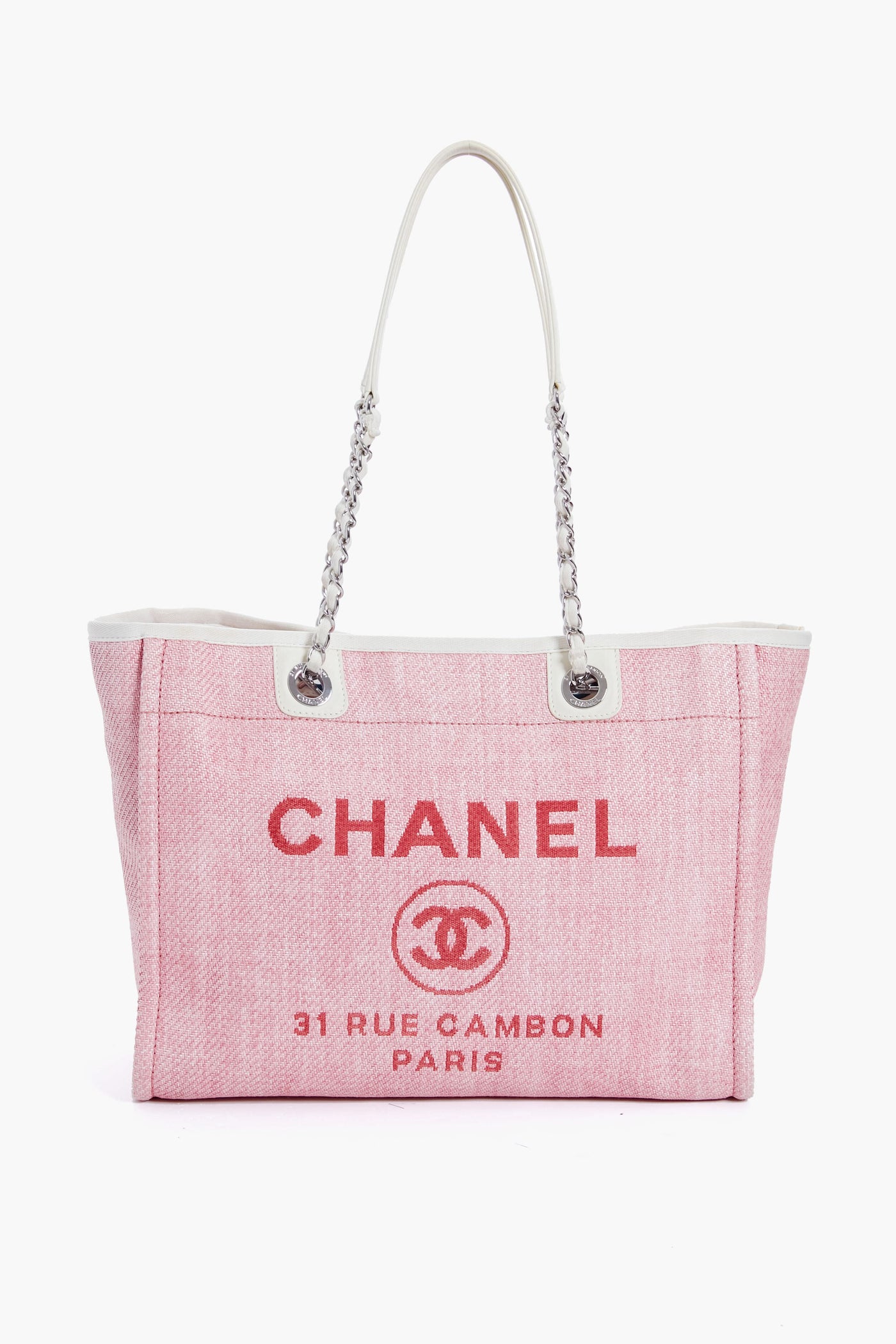 A pink Tuckernuck Archive Collection tote with white handles, featuring the brand logo and classic text on the front.