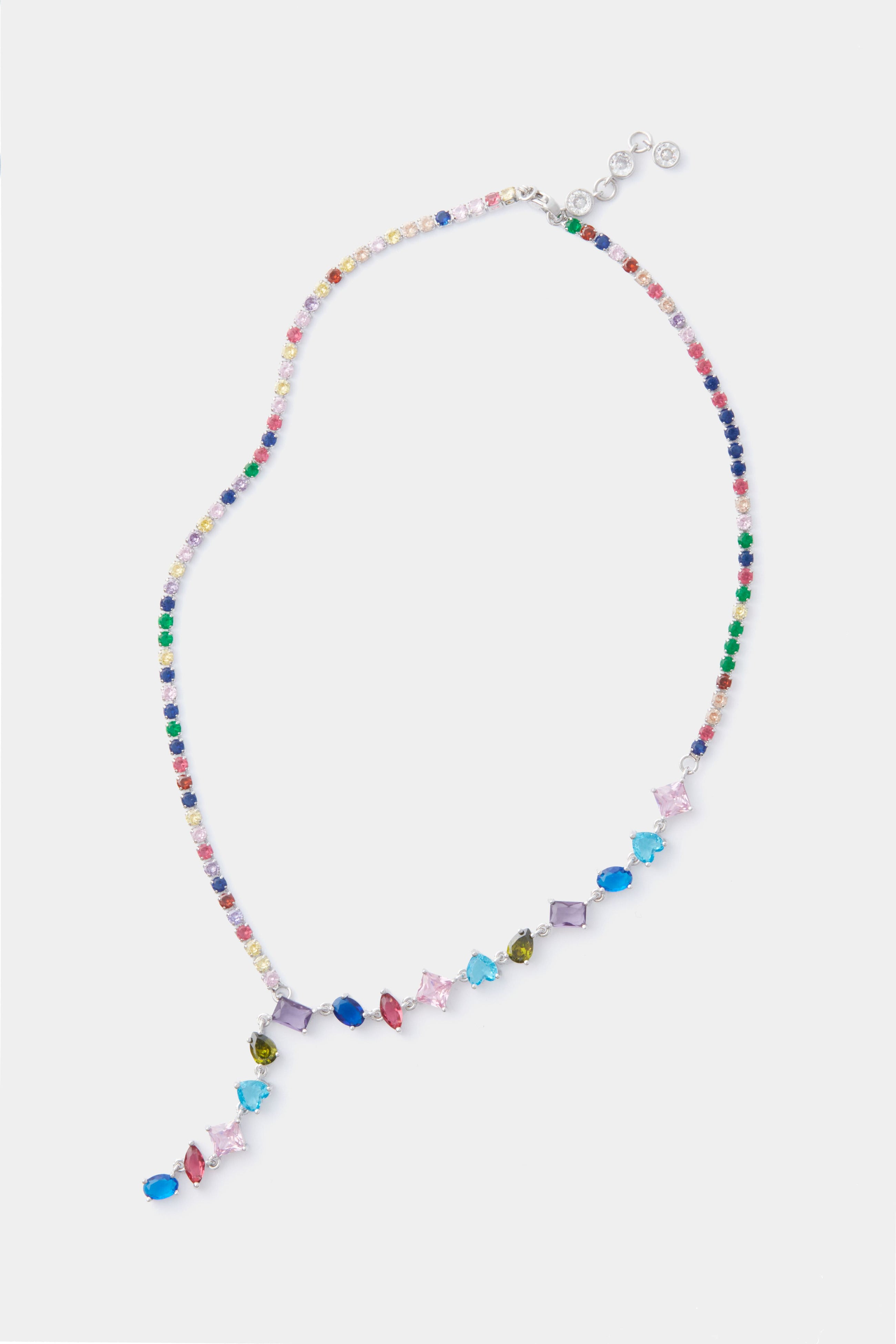 The Petit Moments Multi Colette Necklace features multicolored beads and assorted gemstones in vibrant shapes, creating a colorful crystal statement piece.