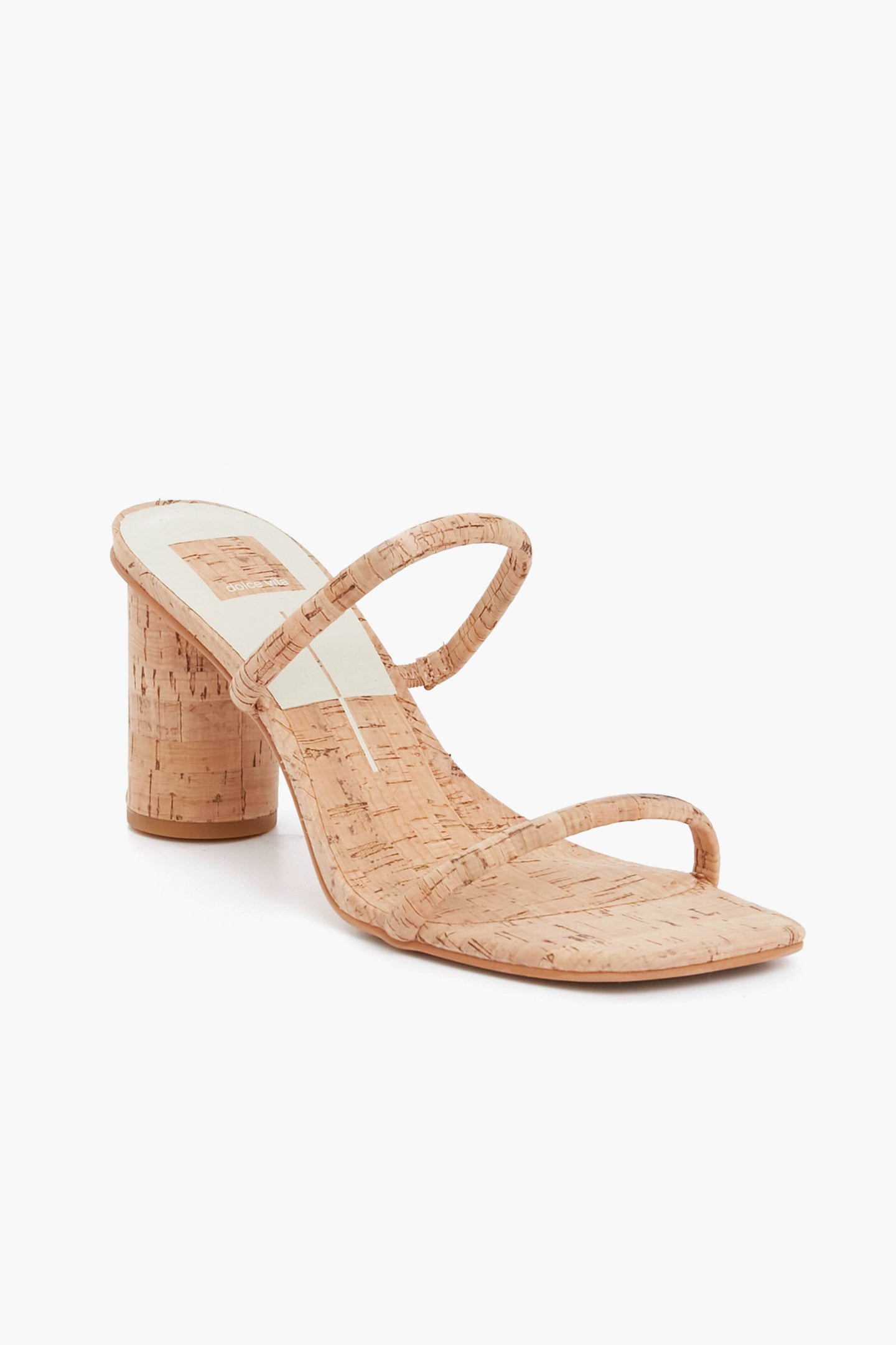 The Dolce Vita cork-textured open-toe heeled sandal features two slim straps and a chunky round heel, adding a modern touch to your look.