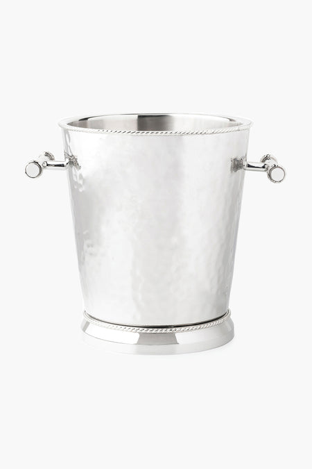 The Juliska hammered stainless steel ice bucket features two side handles, decorative rope accents on the rim and base, and a double-walled design for effective wine cooling.