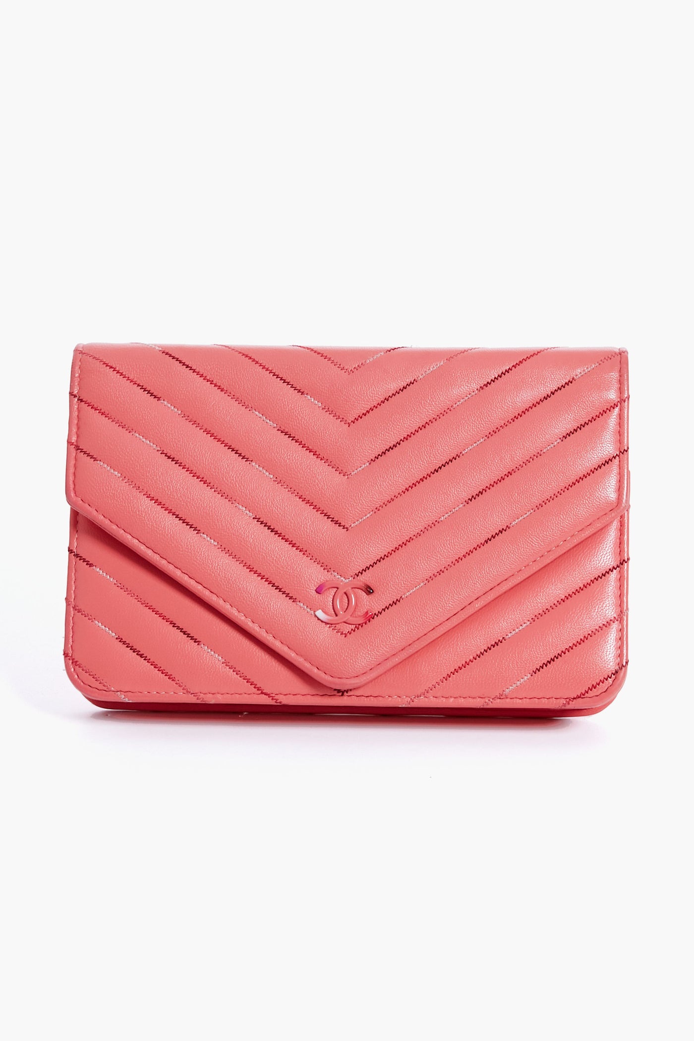 A Tuckernuck Archive Collection Wallet on Chain in pink gradient chevron quilted leather, featuring a small metallic logo on the front flap.