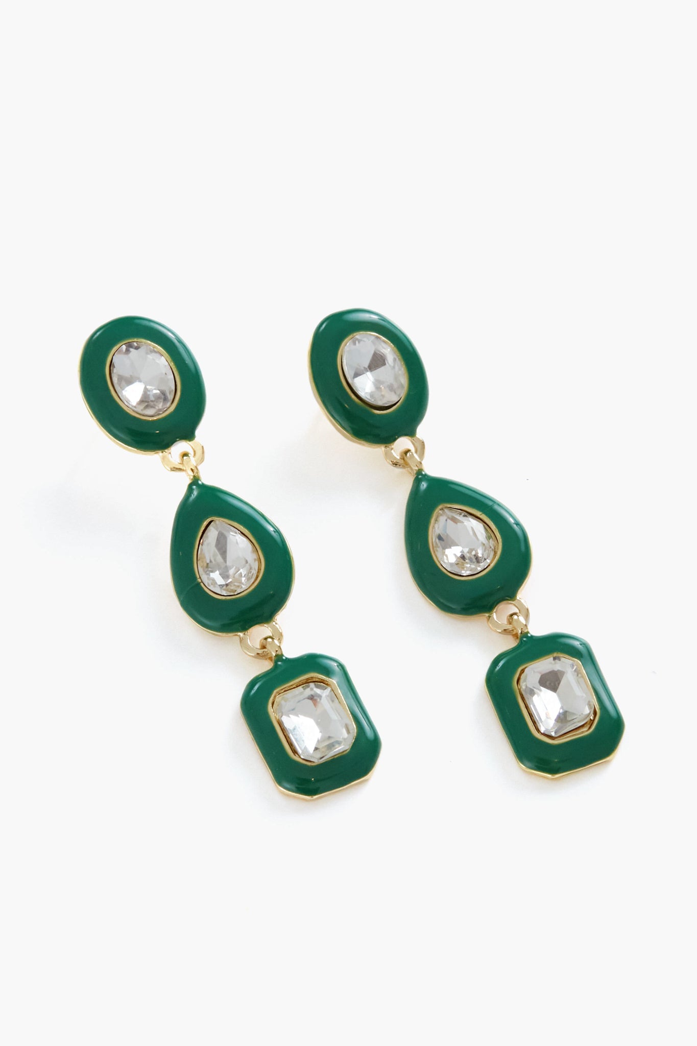 A pair of Petit Moments Green Cole Earrings featuring a gold-tone dangle design with green enamel accents and clear crystal embellishments in oval, teardrop, and hexagonal shapes.
