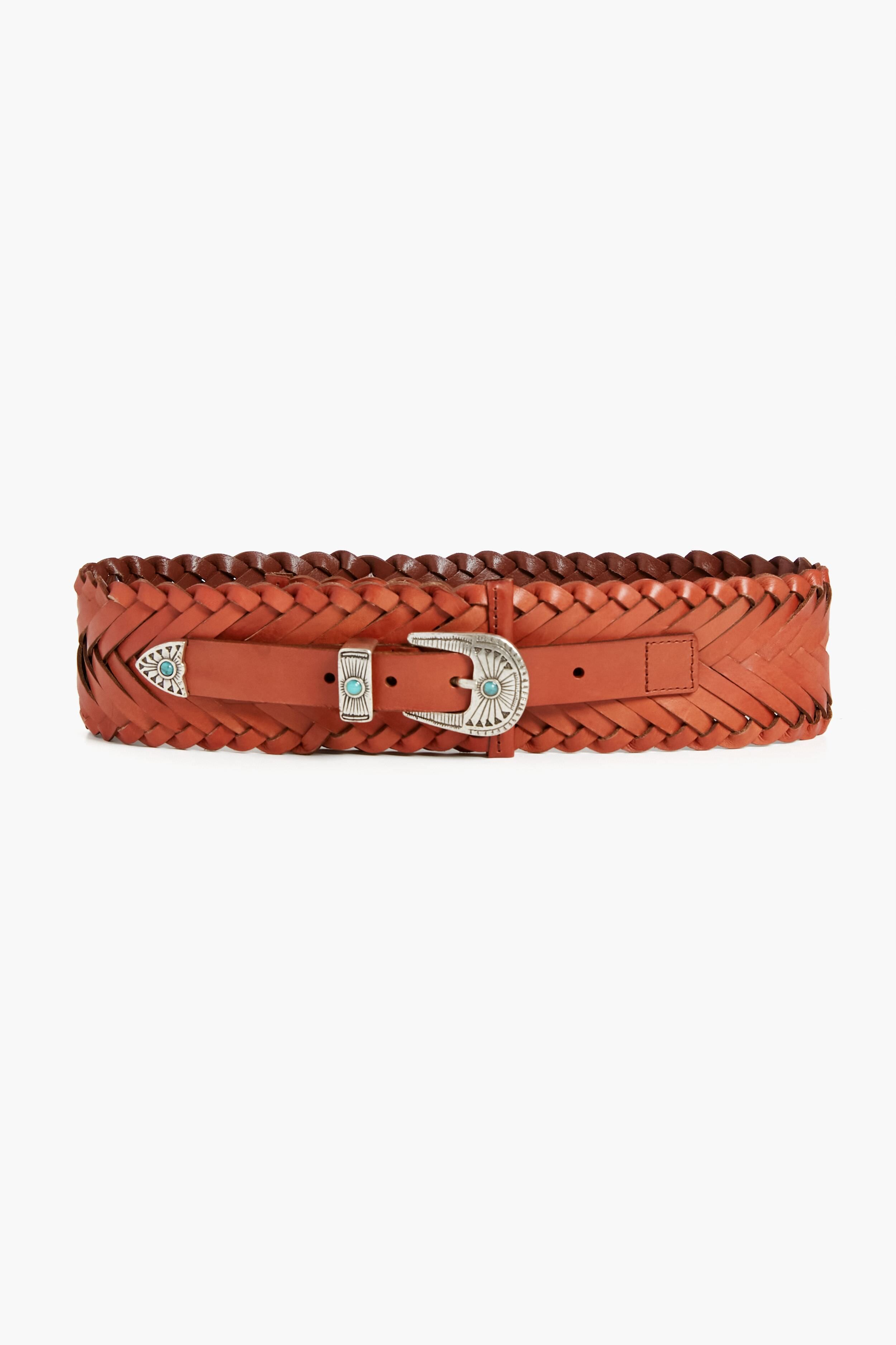 The B-Low the Belt wide brown braided leather belt features a silver buckle, tip, and decorative accents. Displayed horizontally, this western-style accessory adds a stylish touch to any outfit.