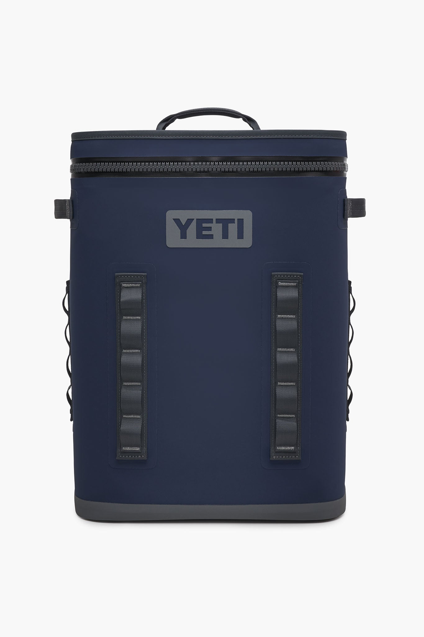 The YETI Hopper BackFlip is a navy blue backpack cooler featuring a top handle, front zipper, side loops, and the YETI logo. Designed by YETI for portability and durability, this leakproof cooler is perfect for on-the-go use.