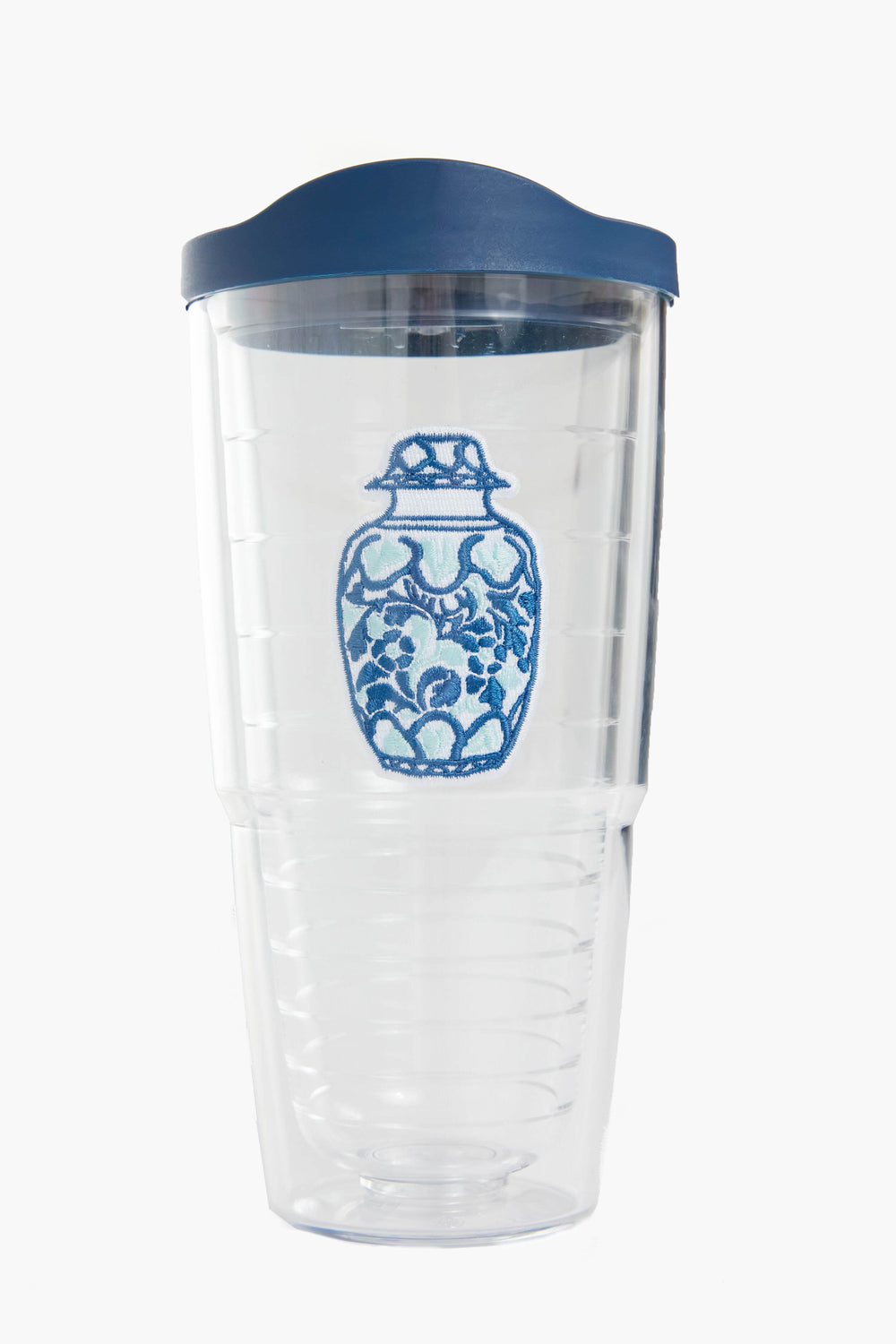 The Tervis Tumbler x Tuckernuck features a blue and white decorative vase design, clear plastic body, blue lid, is BPA-free, and has double-wall insulation to keep drinks hot or cold.
