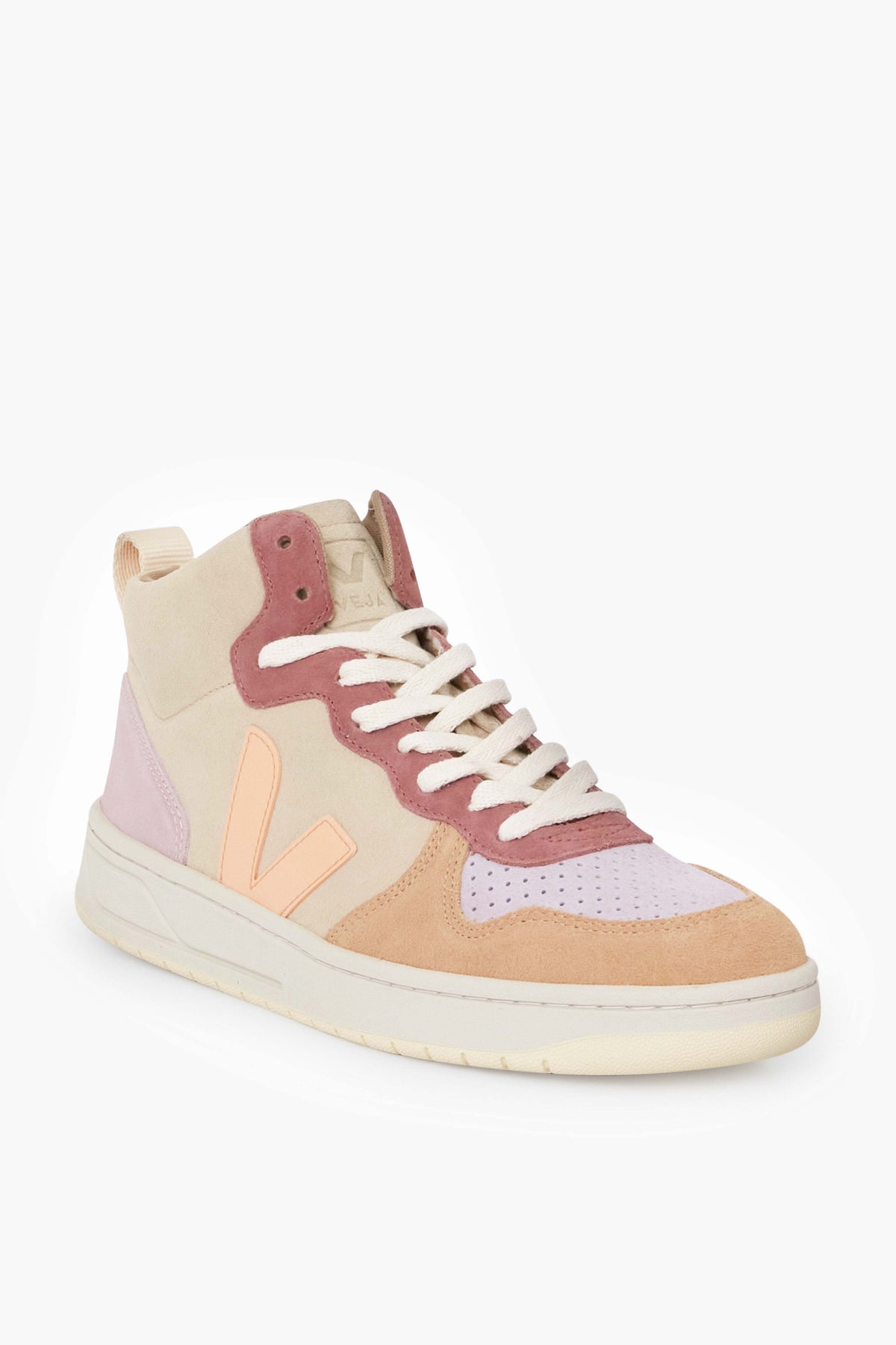The VEJA high top sneaker is sustainably made with a pastel palette—beige, pink, and peach panels—paired with white laces and a cream-colored sole.