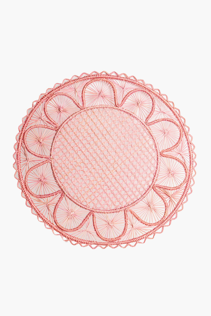 The Coro Cora pink oval lace doily features an intricate geometric pattern and scalloped edges, ideal as a handmade placemat or artisan table accessory.
