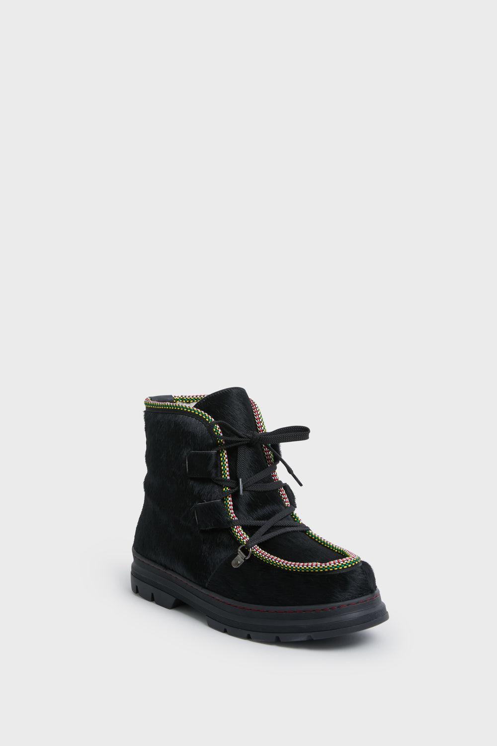 The Penelope Chilvers ankle boot features a textured black surface, multicolored trim, black laces, and a thick sole—perfect as cozy shearling-lined après ski footwear.
