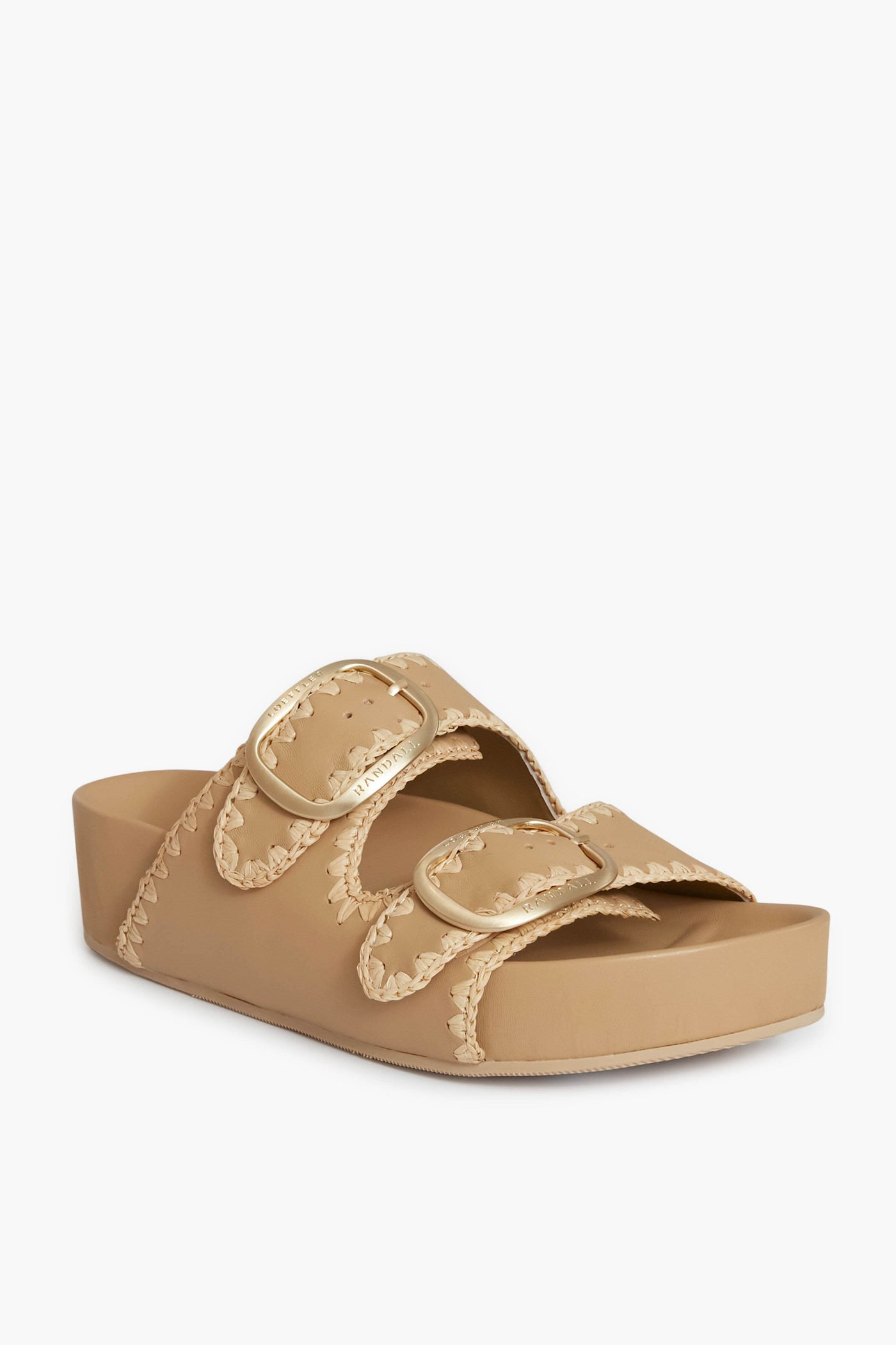 Loeffler Randall tan Vachetta leather sandals with two wide straps, each adorned with a gold buckle and decorative stitching, set on a slightly elevated sole.