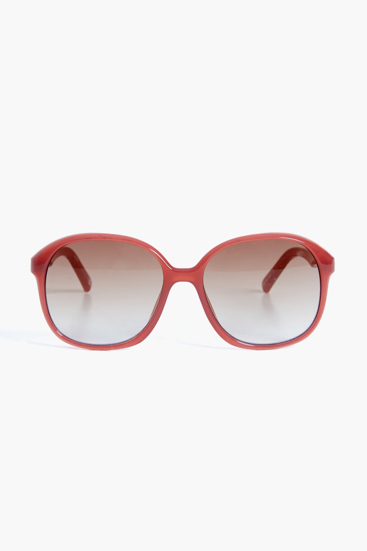 Le Specs red oval sunglasses with dark gradient lenses capture the bold style of the Rose Rouge Stupid Cupid collection.
