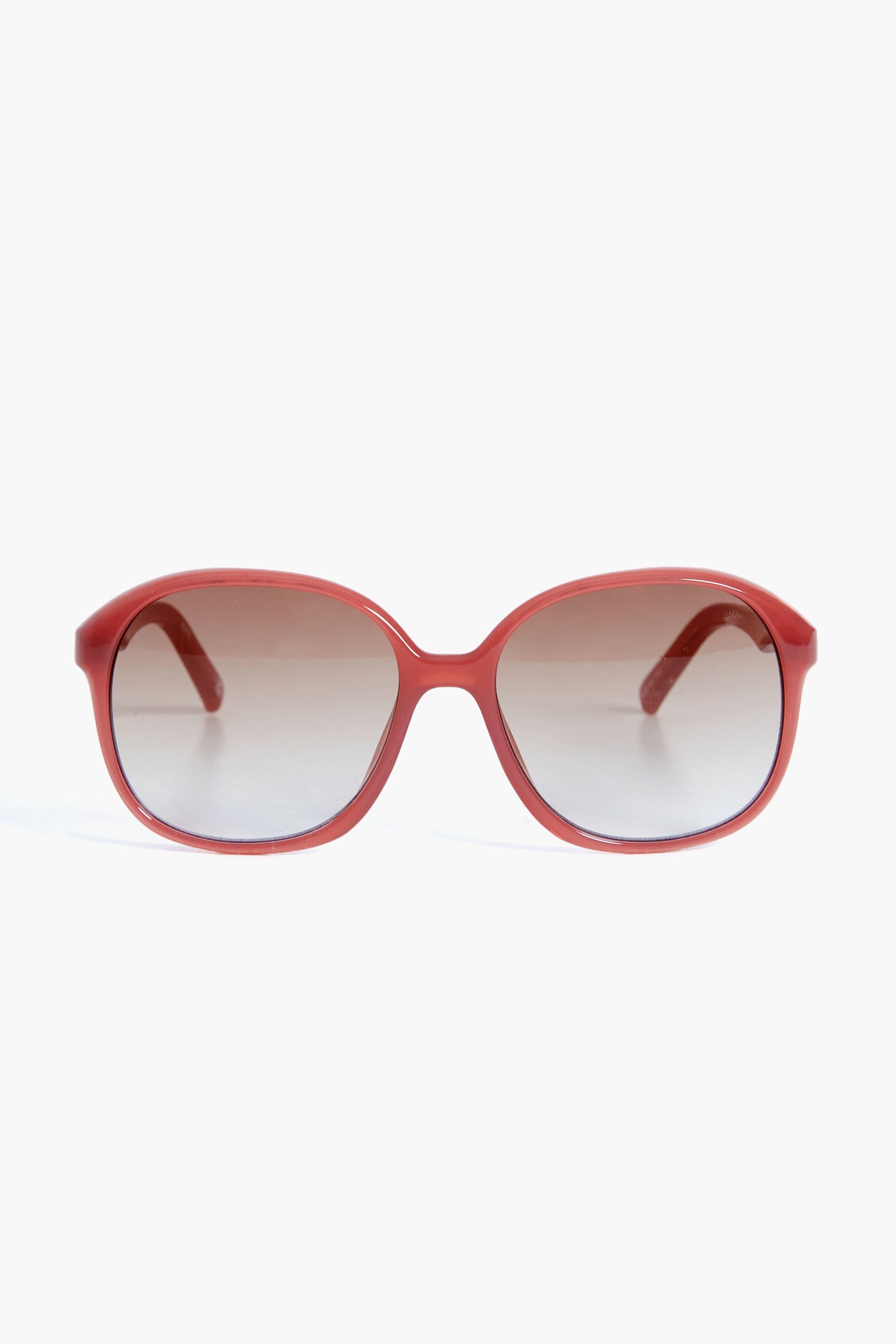 Le Specs red oval sunglasses with dark gradient lenses capture the bold style of the Rose Rouge Stupid Cupid collection.