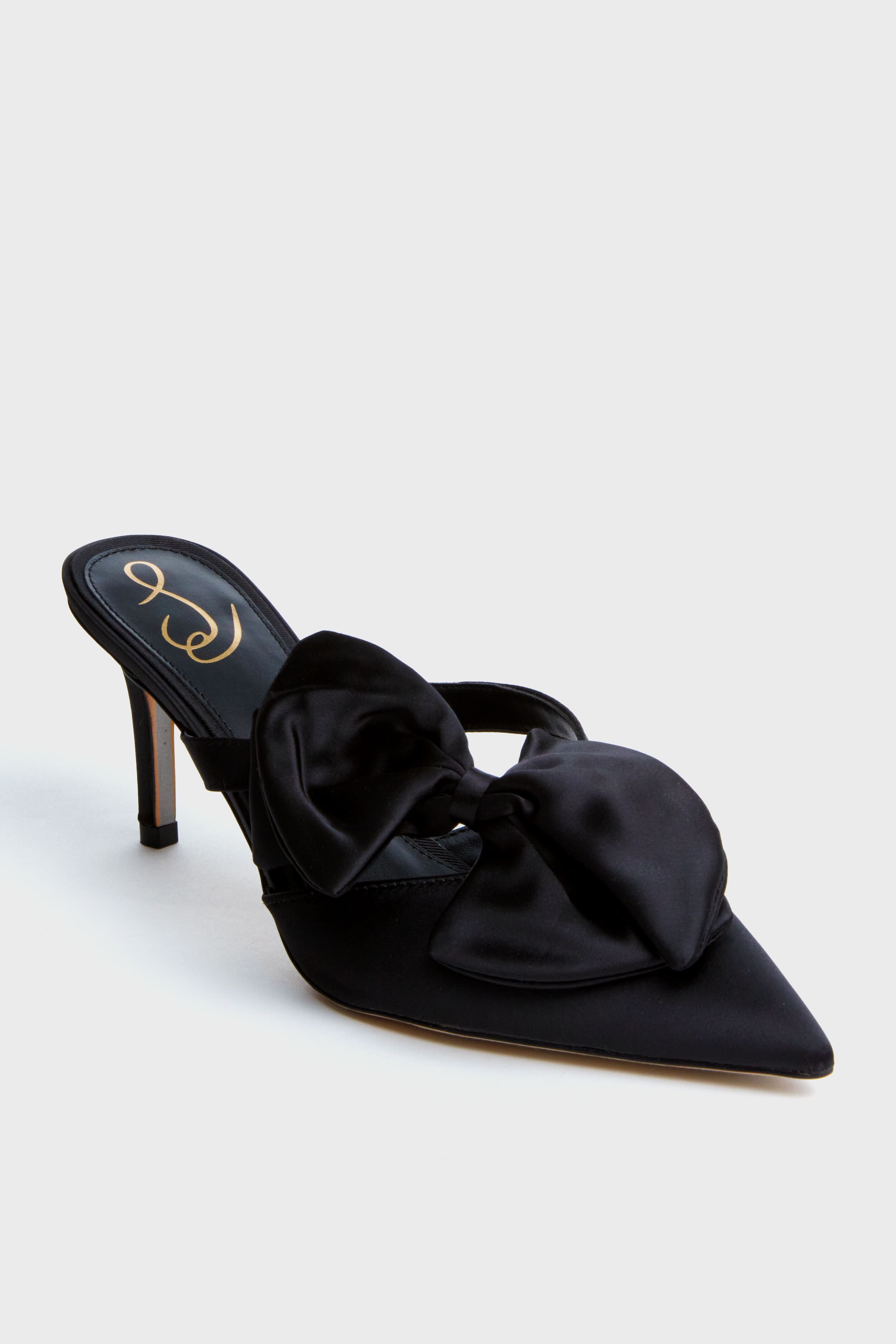 Sam Edelman black pointed-toe satin heels with a large bow, open back, and gold logo on the insole—Veranda Heels that are perfect for any elegant occasion.