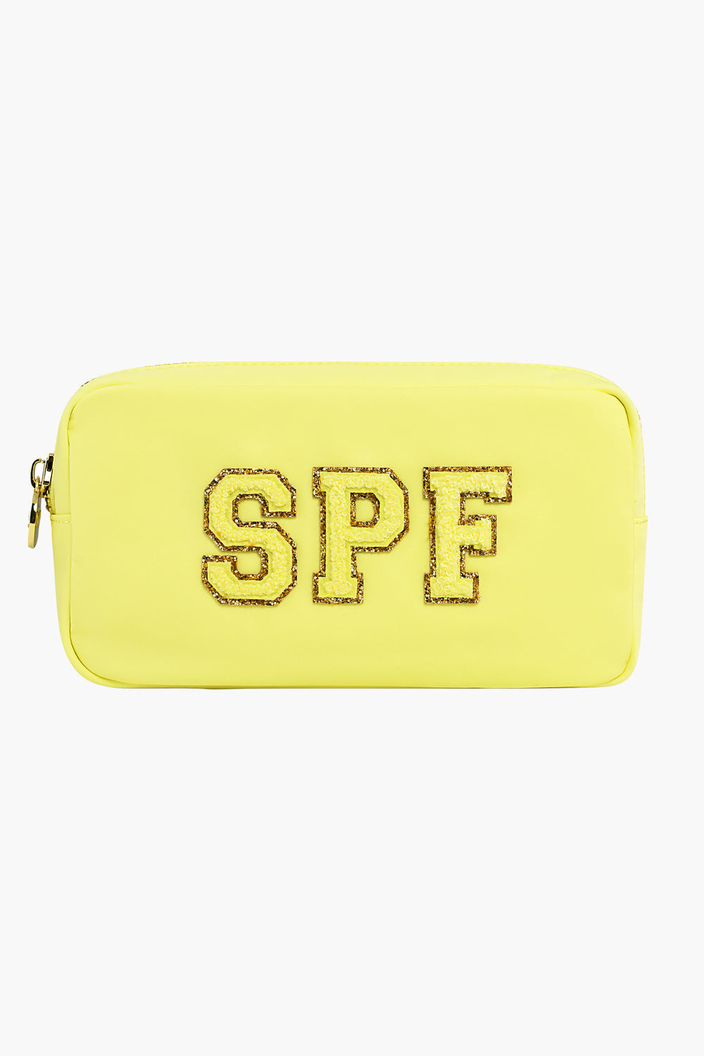 The Stoney Clover Lane rectangular yellow toiletry bag features a zipper and glittery gold-outlined SPF letters on the front—ideal for carrying your travel accessories.