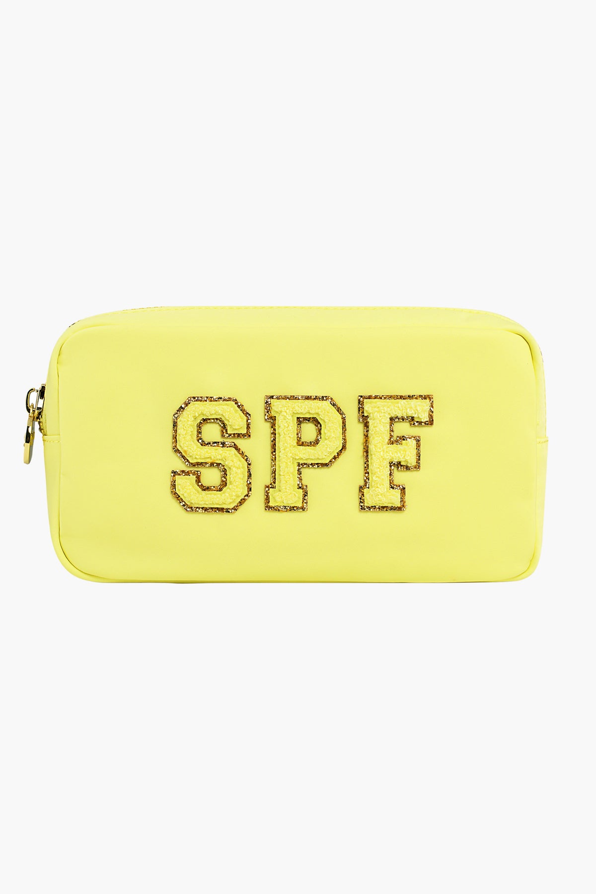 The Stoney Clover Lane rectangular yellow toiletry bag features a zipper and glittery gold-outlined SPF letters on the front—ideal for carrying your travel accessories.
