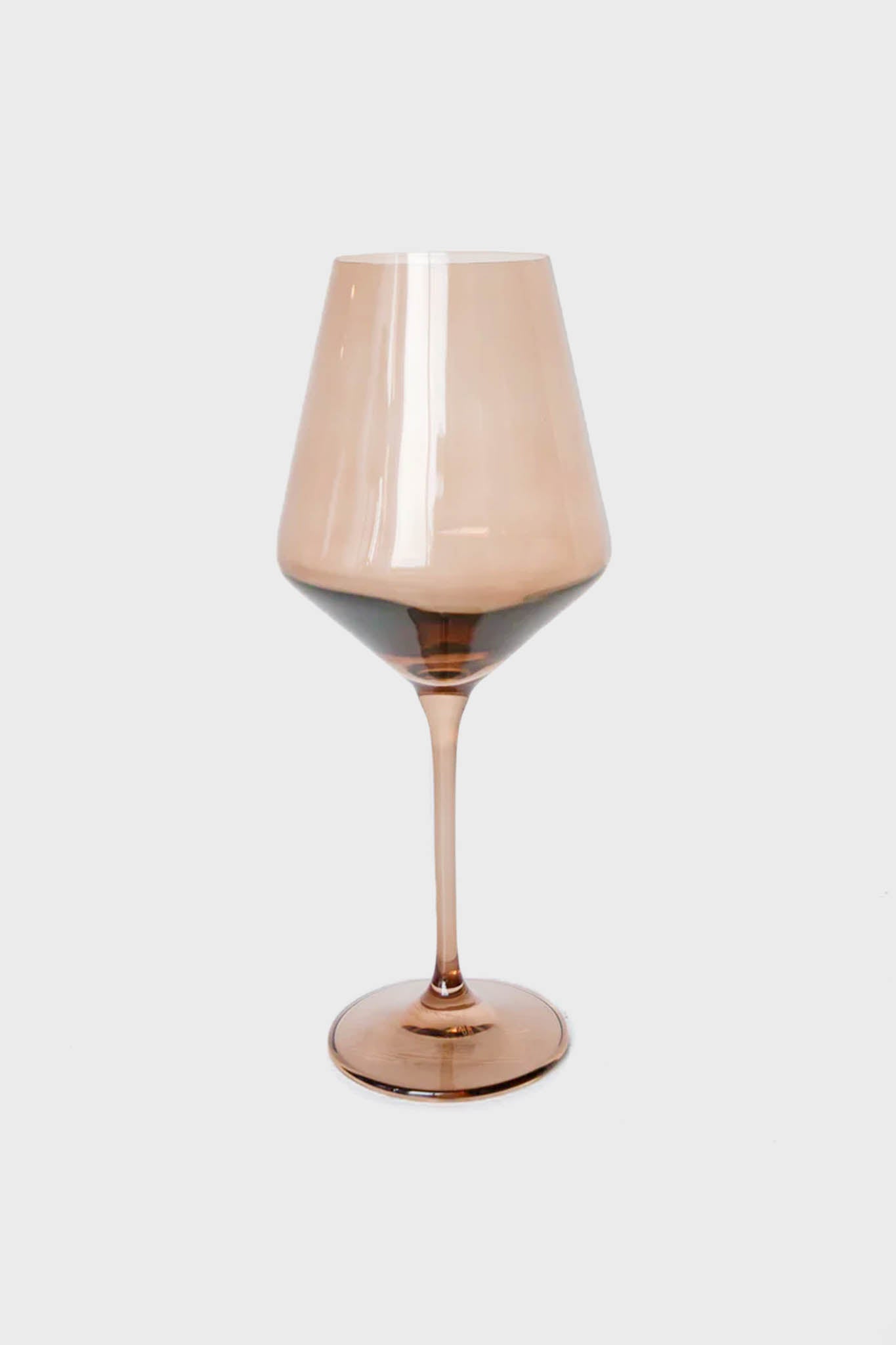 A single Estelle Colored Glass wine glass, vintage-inspired with a brown tint, wide bowl, and slender stem, expertly crafted from hand-blown colored glass.