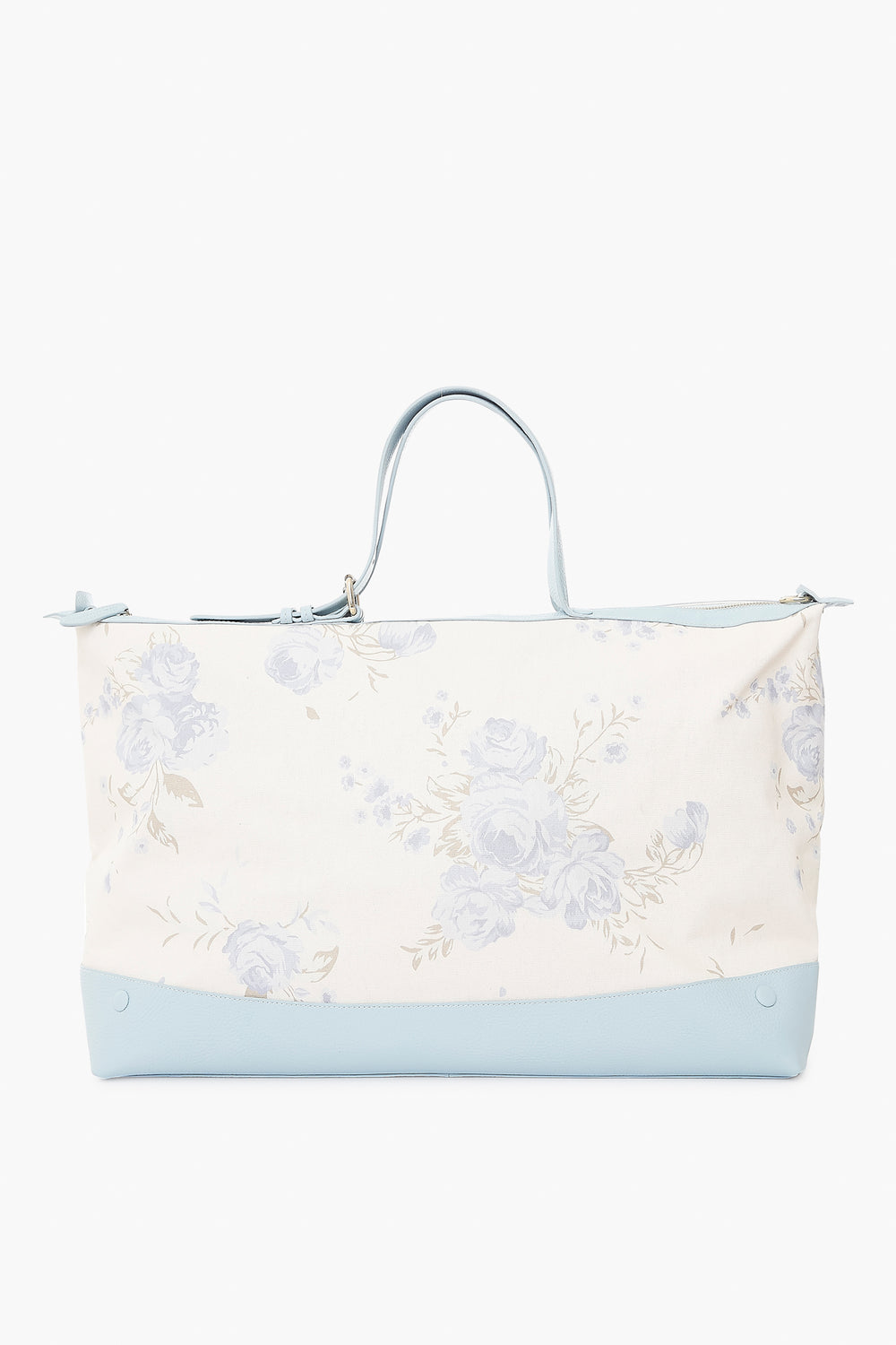 The Julia Berolzheimer x Neely & Chloe Garden Bouquet Mist Weekender is a large cream tote with a blue floral pattern, light blue handles, and a light blue base—perfect for stylish travel.