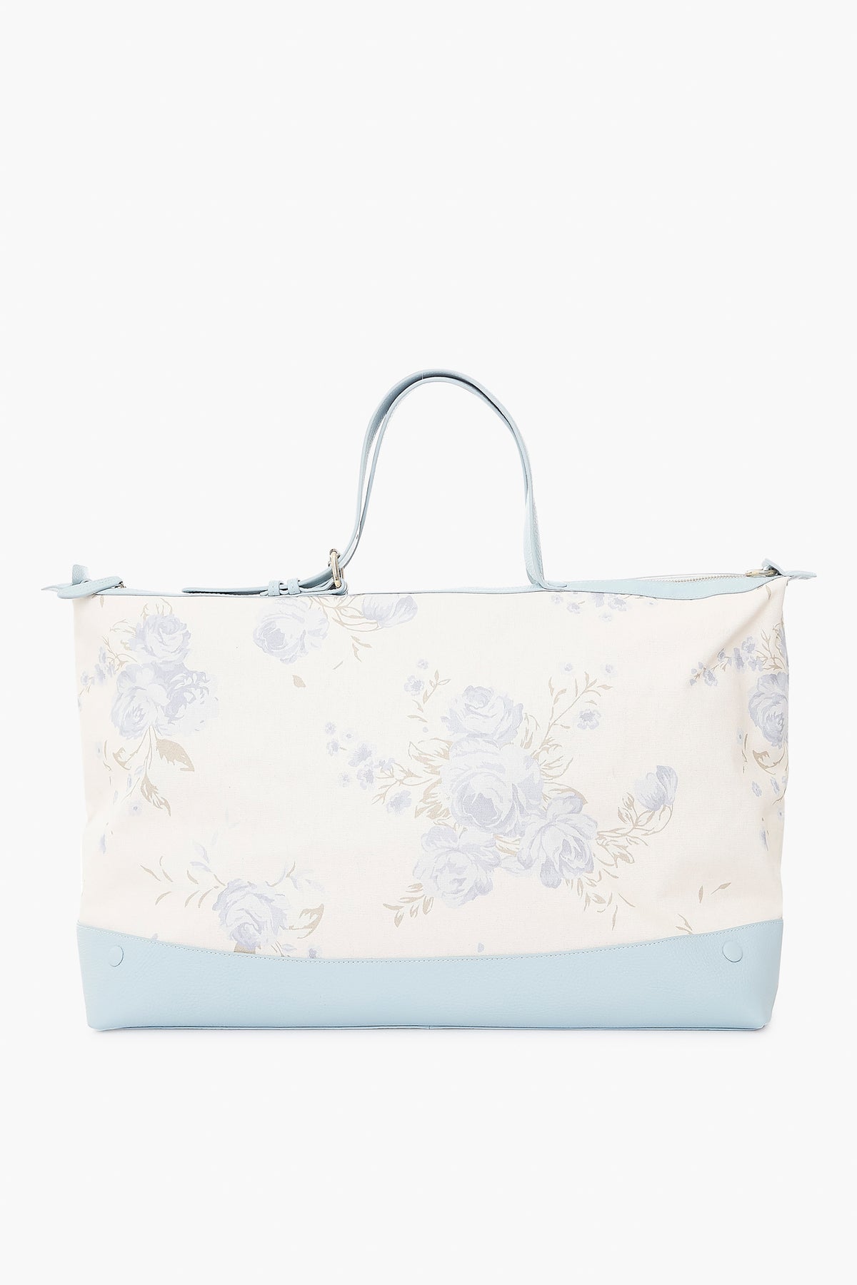The Julia Berolzheimer x Neely & Chloe Garden Bouquet Mist Weekender is a large cream tote with a blue floral pattern, light blue handles, and a light blue base—perfect for stylish travel.