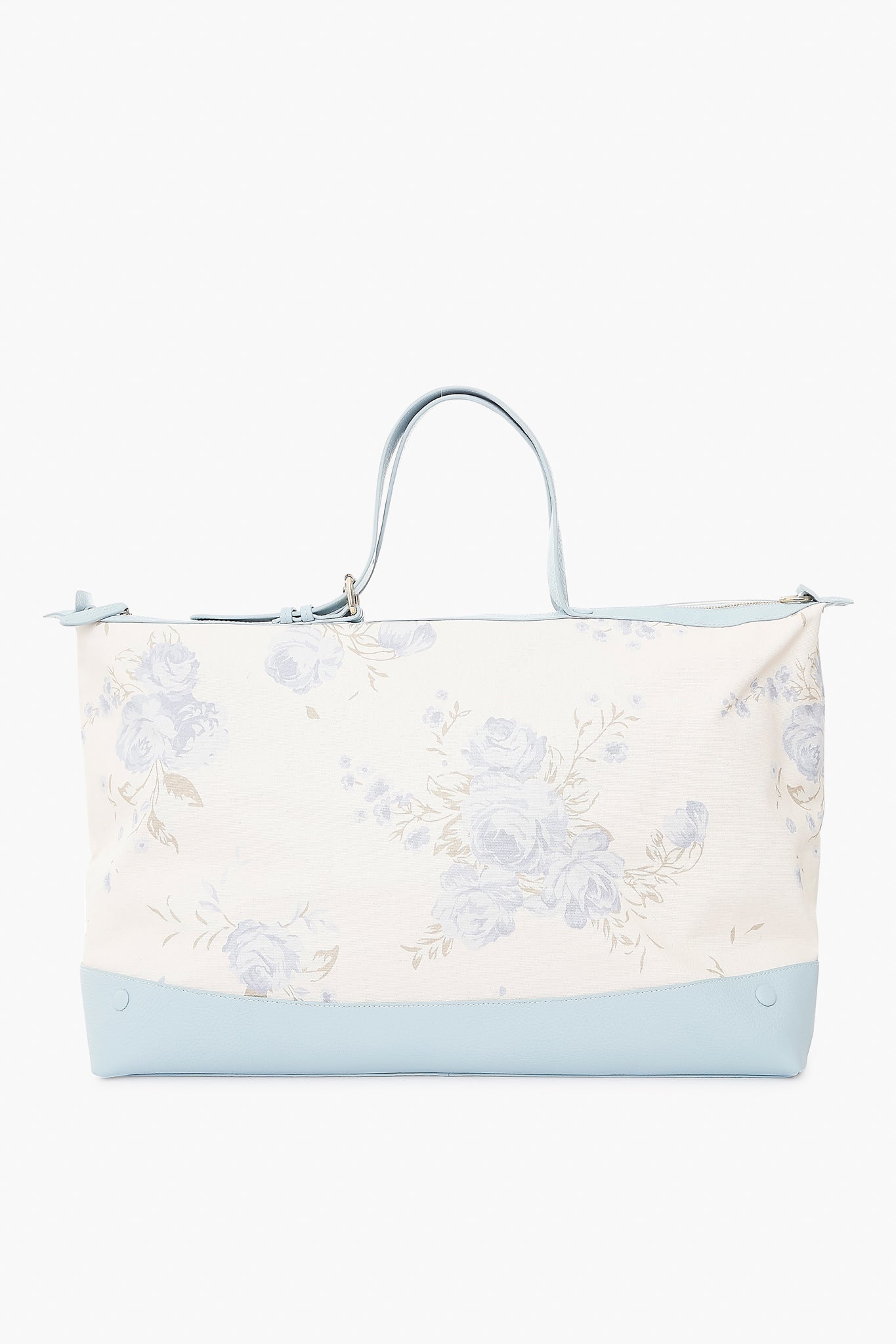 The Julia Berolzheimer x Neely & Chloe Garden Bouquet Mist Weekender is a large cream tote with a blue floral pattern, light blue handles, and a light blue base—perfect for stylish travel.