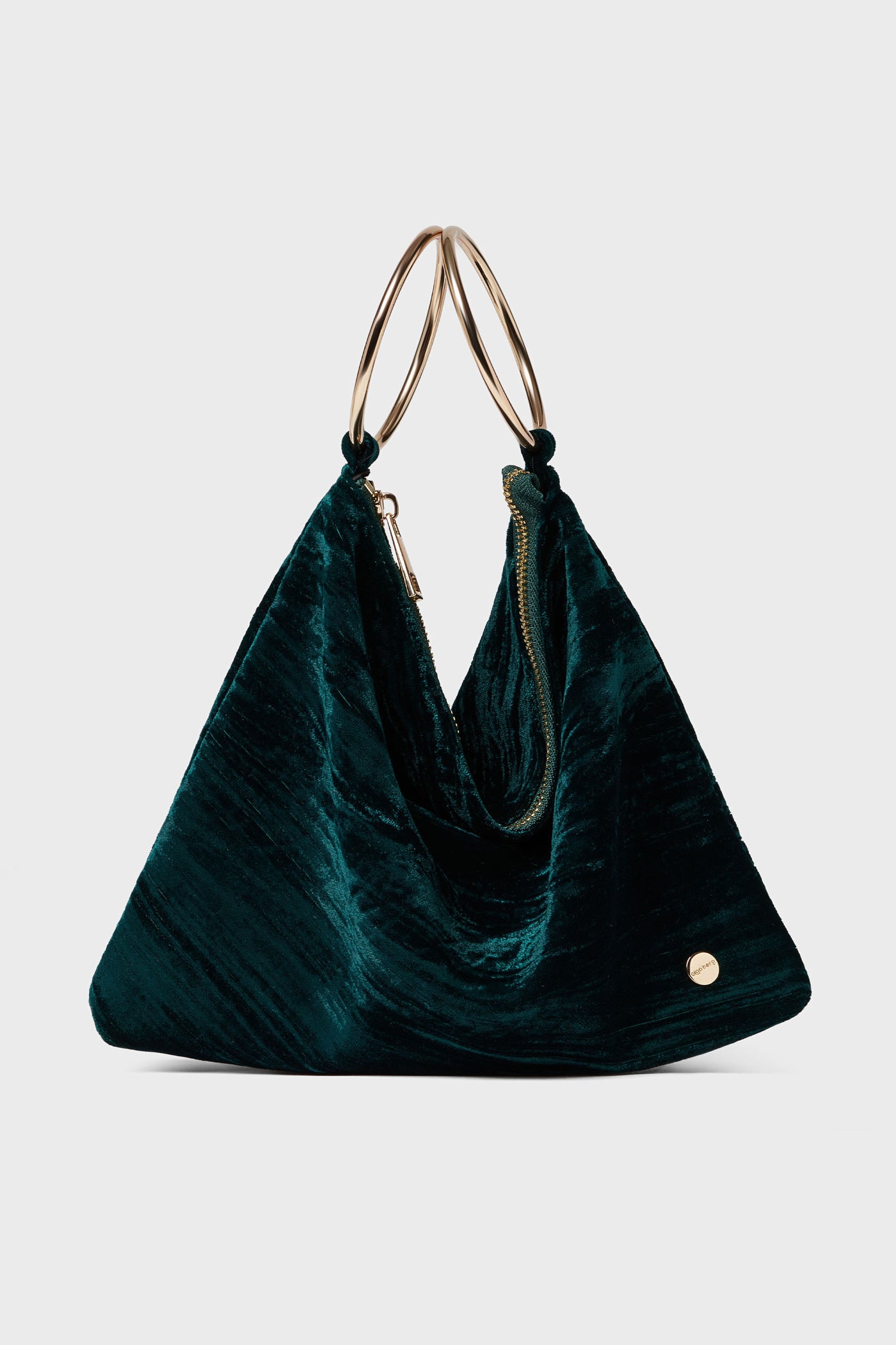 Olga Berg emerald green velvet convertible bag with gold metal handles, zipper closure, and a small round gold emblem—a chic addition to your women's accessories or evening bags collection.