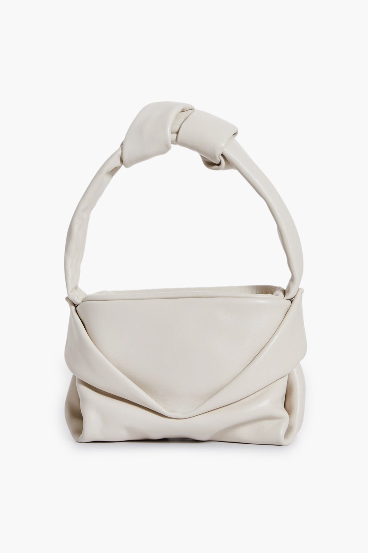A cream lamb handbag by STAUD with a soft, folded design and thick knotted handle, reminiscent of the Cream Kiss Bag.